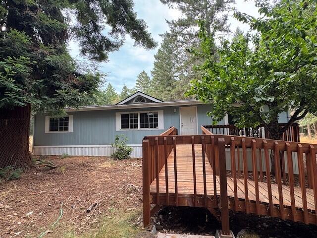Renovations Complete on this lovely home tucked in the woods on 2.5 private acres! Brand new roof & skirting, in addition to new paint, counter tops, bathrooms, flooring, light fixtures, ceiling fans & doors! This home sparkles & features accessible ramp entry, is 1248 sq ft, 3 bedrooms, 2 full baths with vaulted ceilings, sky lights & open floor plan. The land has been cleared & is a blank slate for your imagination. There is also a detached 2 car garage!