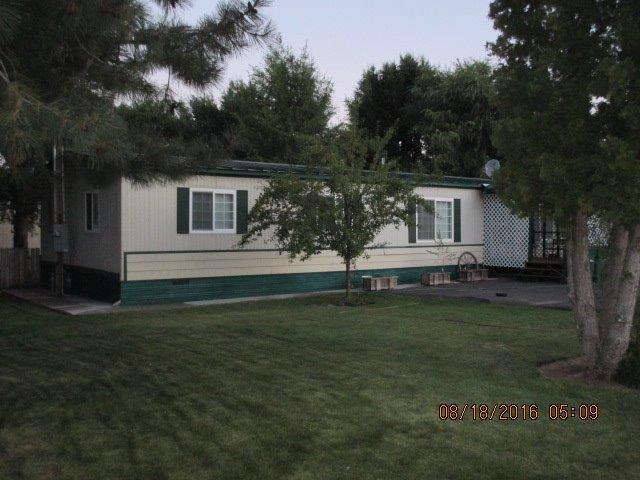 3BR, 2BA Mfg home with living room and family room. Updated kitchen, enclosed porch and large shop/garage (32 x 32). Driveway was recently resurfaced. Nearly 3/4 acre on 4 separate tax lots. Lush lawns, garden area and chicken coop. #134,900.