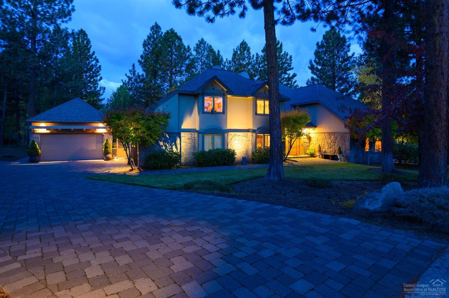 Double Master Custom Home on the top of Awbrey Butte sitting on 0.74 acres w/an oversized 4 car garage. Click the virtual media link for a narrated video walkthrough w/aerial drone footage. The kitchen has slab granite & great breakfast bar seating w/dining area that connects to the living room w/a see through fireplace that creates an area seamless for entertainment. Nearby is a formal dining, living room, & ensuite. The master on the second floor has a separate shower/toilet room, well organized closet, jetted soaker tub, a private deck & it's nicely separated from the 2 guest bedrooms & guest bath. The daylight basement has a game area, theater room, living room, pantry, full bath, & a bedroom. The back deck/patio is fully fenced & has a great courtyard area w/pavers & a hot tub. This home is fantastic for large groups of all kinds & would be an amazing vacation home or corporate retreat space to keep people engaged in several well-designed core areas while having privacy as well.