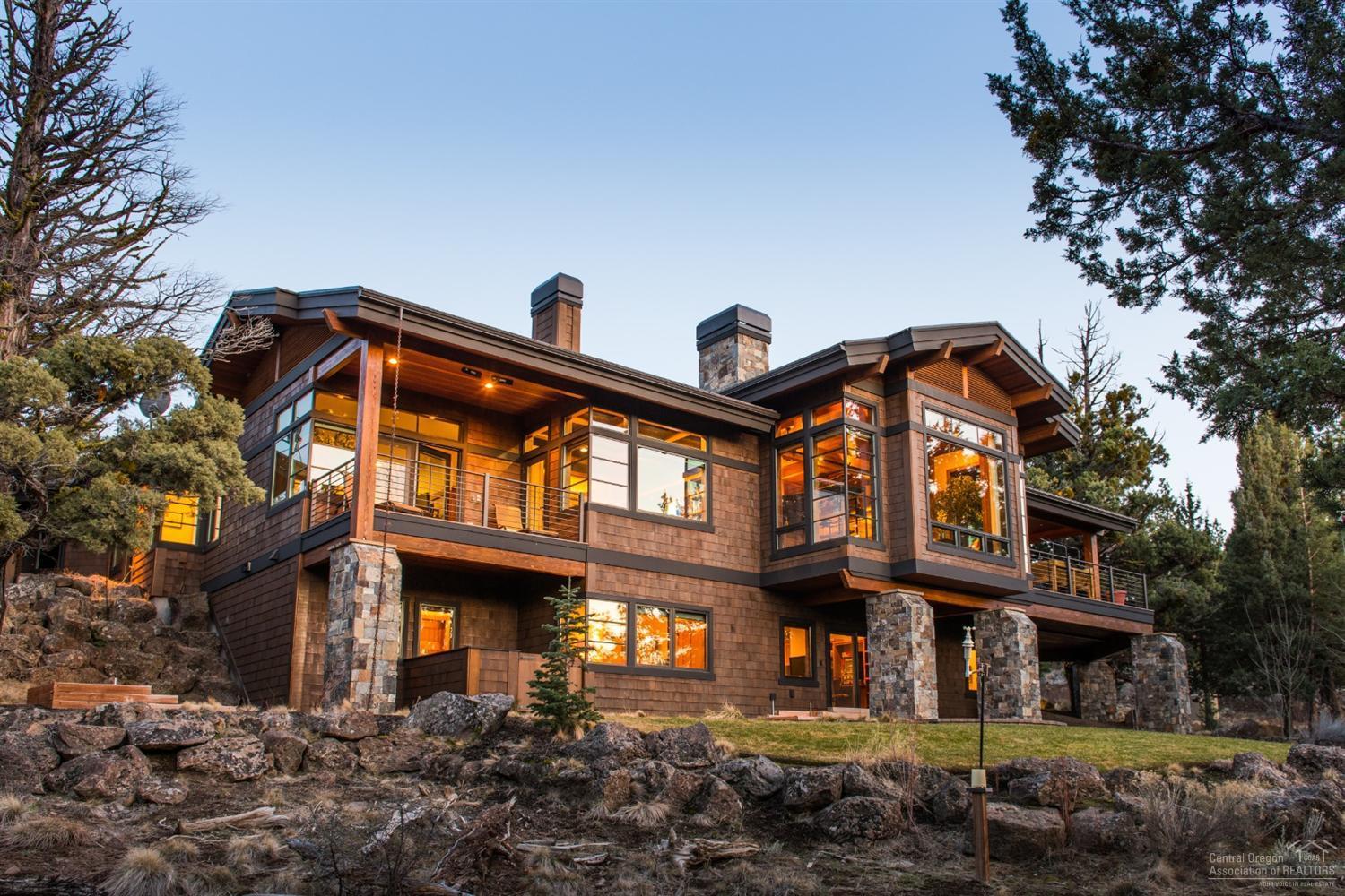 Exceptional custom home by Norman Bldg & Design offers the finest in craftsmanship and finishes. Floor to ceiling windows frame gorgeous Cascade views. Thoughtfully-designed plan includes main level master suite and home office, 2 add'l en suite bedrooms, bonus room & wine closet downstairs. Top of the line chef's kitchen features Blue Star ovens + 6-burner gas stove, wood-fired oven, Sub Zero & Miele appliances. Opens to a covered deck, perfect for al fresco dining. Private 1 acre setting close to trails.