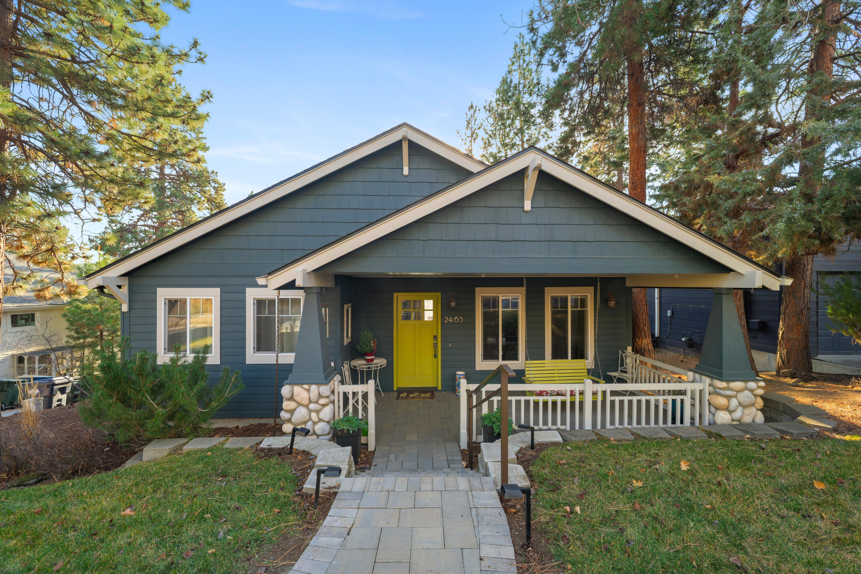 Located in one of NW Bend's most desirable pockets, this single-story Craftsman offers timeless curb appeal and flexible living. The covered front porch with swing creates a welcoming first impression, while vaulted ceilings and a gas fireplace add warmth and scale inside. The kitchen features quartz countertops, large island, modern appliances, and an efficient open layout. The primary suite includes a dual vanity, walk-in closet, and comfortable separation from secondary bedrooms. The basement expands the home's functionality with a second primary suite fourth bedroom or spacious family room, ideal for multigenerational living, guests, a private mother-in-law setup, or future ADU potential. Recent improvements include a new roof, furnace, A/C and updated finishes throughout. The fully fenced backyard provides privacy and space for pets, play, or entertaining. Conveniently located near schools, Northwest Crossing, and Shevlin Park, this home delivers location and livability.
