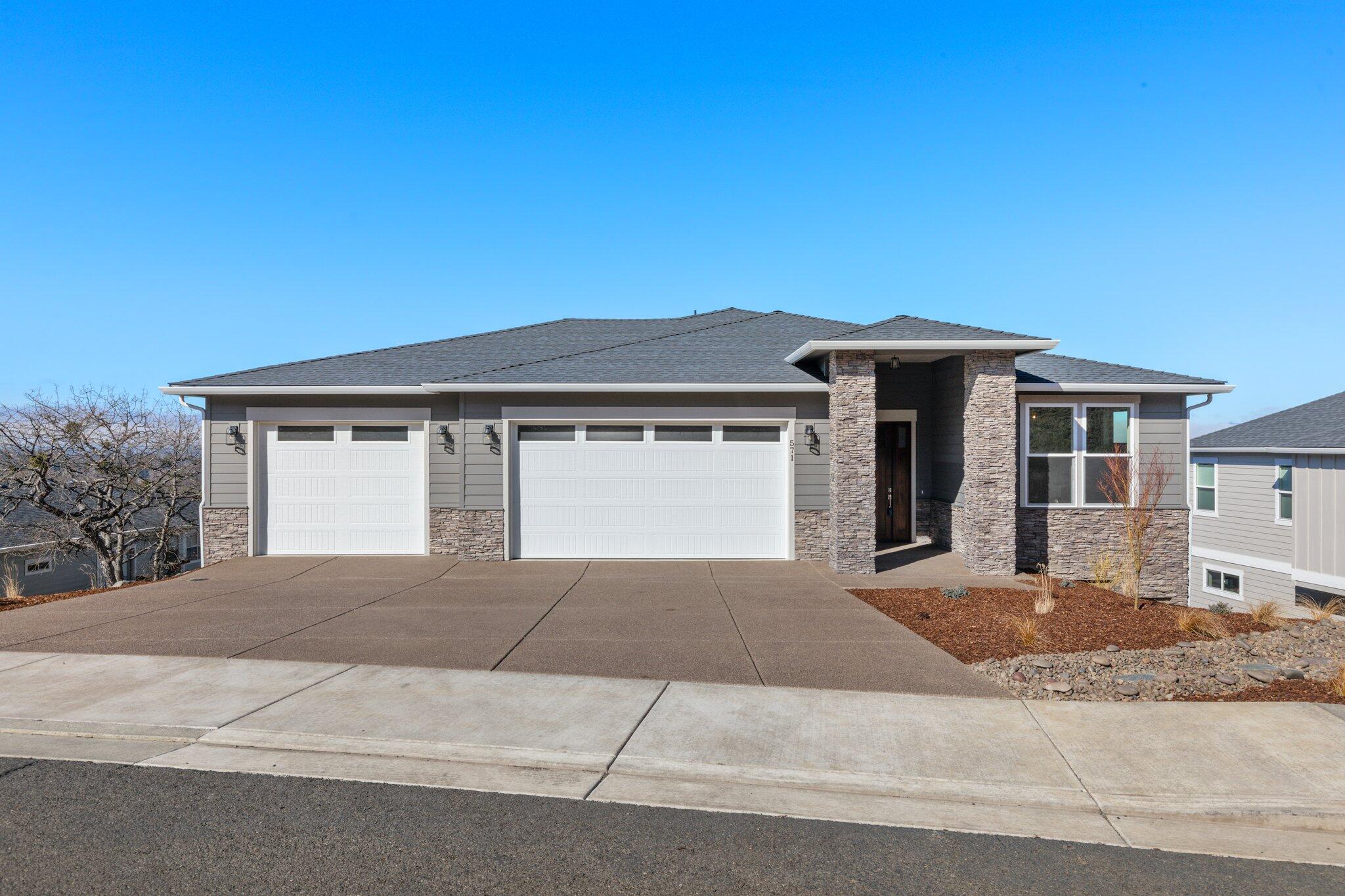 Brand new construction in the coveted Bella Vista Heights neighborhood of East Medford.  Designed with distinction, energy efficiency and a contemporary flair!  Over 3,425 sq. ft. with 180 degree views, 4 bedrooms plus office and 3.5 bathrooms, 3 car garage and two decks.  Built with ease of living in mind, the primary bedroom is on the main floor and includes such amenities as a large walk-in closet, washer/dryer and to-die-for primary bathroom.  The main floor also includes an office and half bath, large modern kitchen with gas cooktop and custom hood, refrigerator , huge pantry, and much more.  Separate dining area with view, a great room with gas fireplace, built-ins and a deck with more views.  The lower level has three bedrooms, two full baths, a family room with wet bar, additional laundry room, second deck and more.  Quartz counters throughout this gem and abundant storage capabilities that provide many possibilities.
