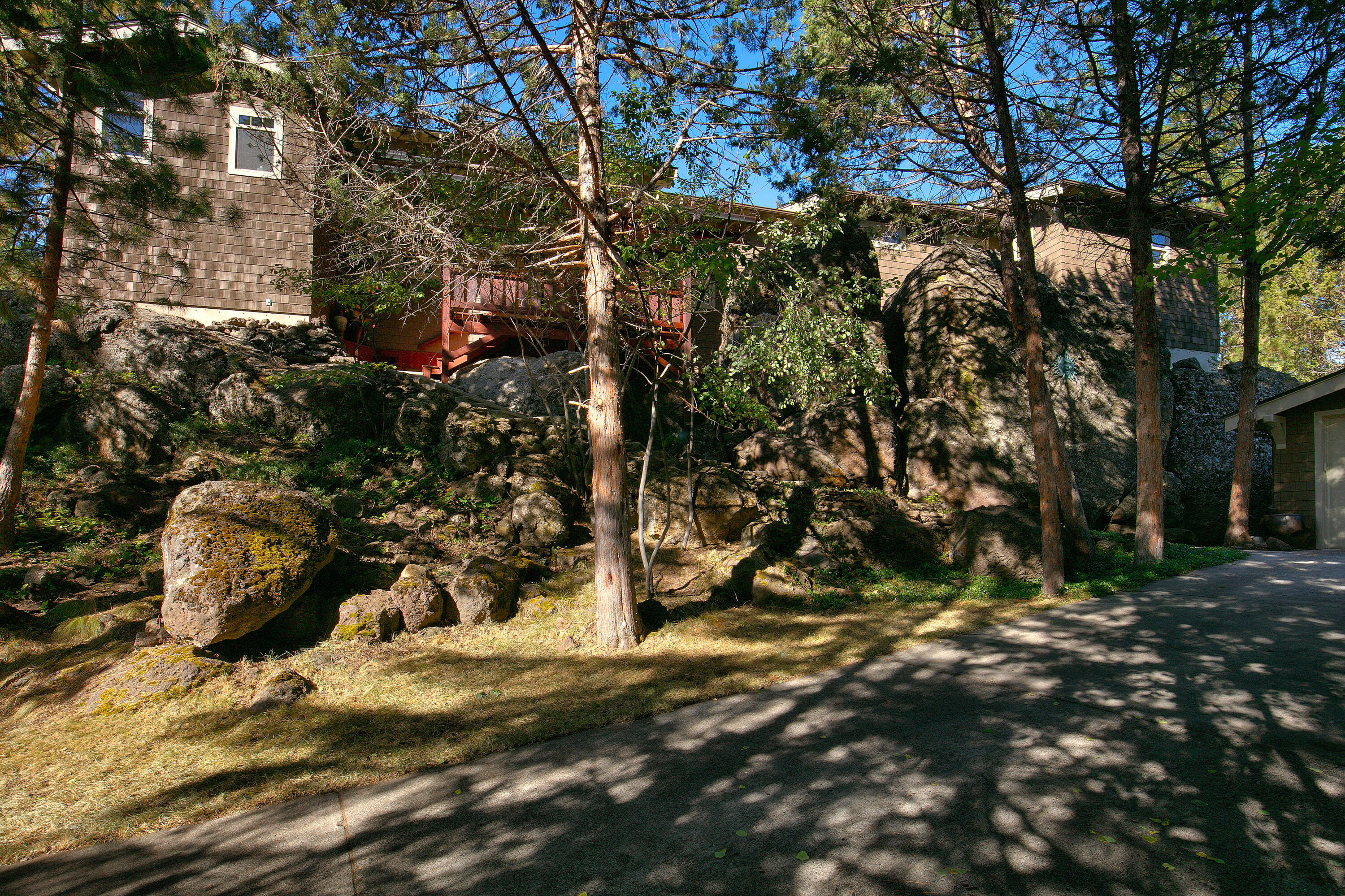 Poised at the top of Golden Butte, this mountain elegant home is made for lifestyle living! Heated steps tucked among huge boulders, whole house heated floors, west facing windows with mountain views. Watch the groomers on Mt. Bachelor! With upgraded chefs kitchen with Sub Zero appliances, this home is one of a kind! Situated beside the 36-acre park, recreation is right out the door! Cozy great room offers wood burning fireplace extraordinaire. Nice separation between owners suite and guest areas. Big media room, second guest suite, and a bunk room for kids! Gear room offers warm spot for all your Central Oregon gear. Flex space. Overturf Butte is a 36-ac. park contiguous to the house, so recreation is right out your door!