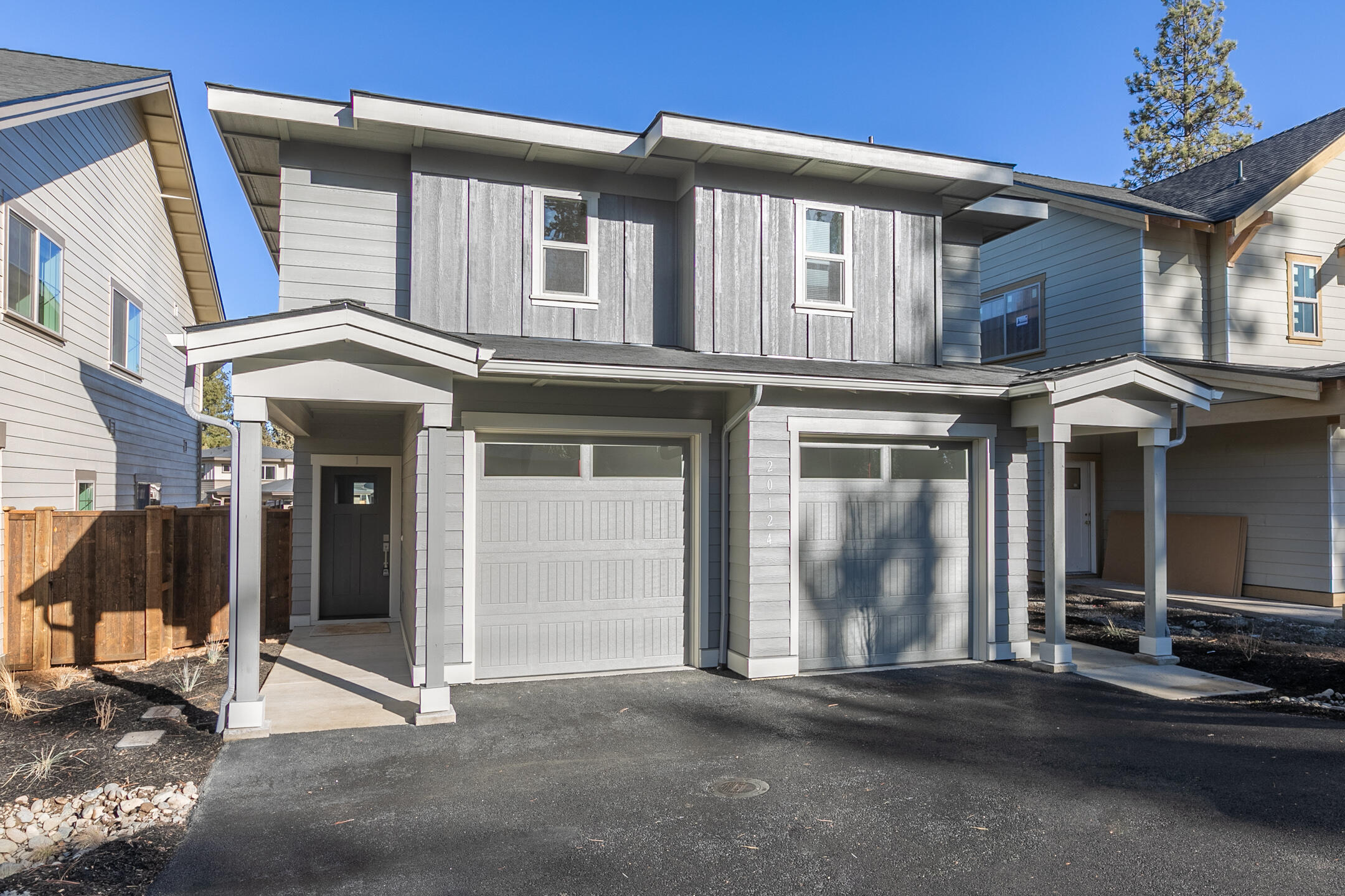 This like new duplex is a turn key investment opportunity in the great rental market of Bend, OR. Features open living space with 3 bedrooms and 2.5 baths per side. Upgraded and thoughtful finishes throughout the duplex include: Quartz countertops, beautiful alder cabinets, stainless appliances, waterproof plank flooring, hand textured walls and high efficiency ductless heat pumps with air conditioning. Attached insulated garages with automatic openers and extra storage units outside. The fenced yards feature a concrete patio area, enclosed storage, xeriscape landscaping in front and hardscaping in the backyard. Property is fully occupied with leases in place and professional property management available. Contact the listing agent for rental financials and more information.