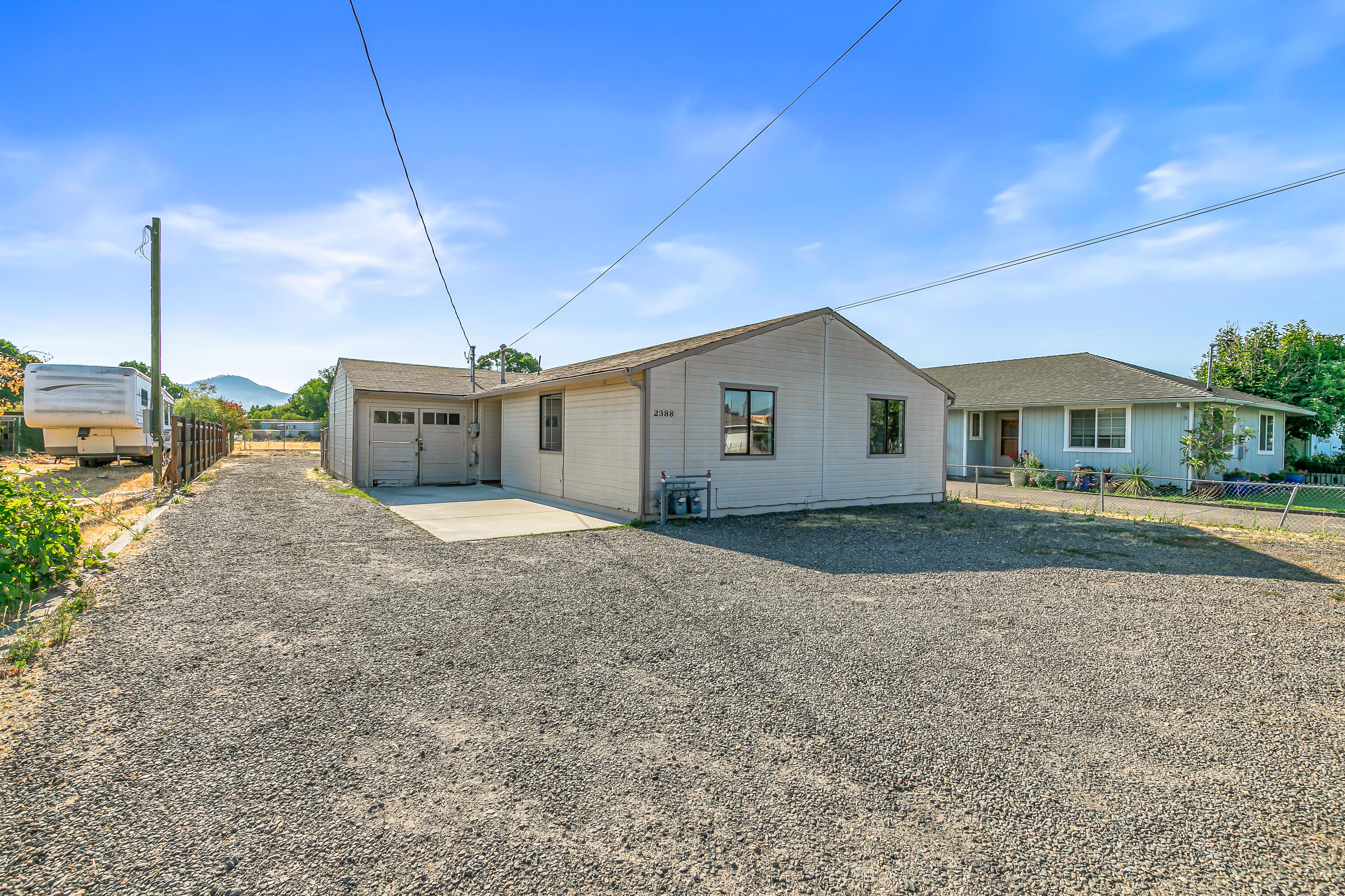 Calling all investors and visionaries! This 3 bed, 2 bath home is a diamond in the rough, ready for your tools and imagination. Sitting on a flat and usable 0.25-acre lot, there's room to create something truly special. The previous shop in the backyard was lost to fire, but the existing foundation offers a unique opportunity to rebuild—whether it's a new shop, ADU, or possible duplex. Zoned SFR-6, this property holds great potential for additional units (buyer to do their own due diligence). With its central location near shopping, dining, and schools, this fixer-upper is in a prime spot for growth and value-add. Don't miss this chance to bring new life to a home with solid bones and endless possibilities!