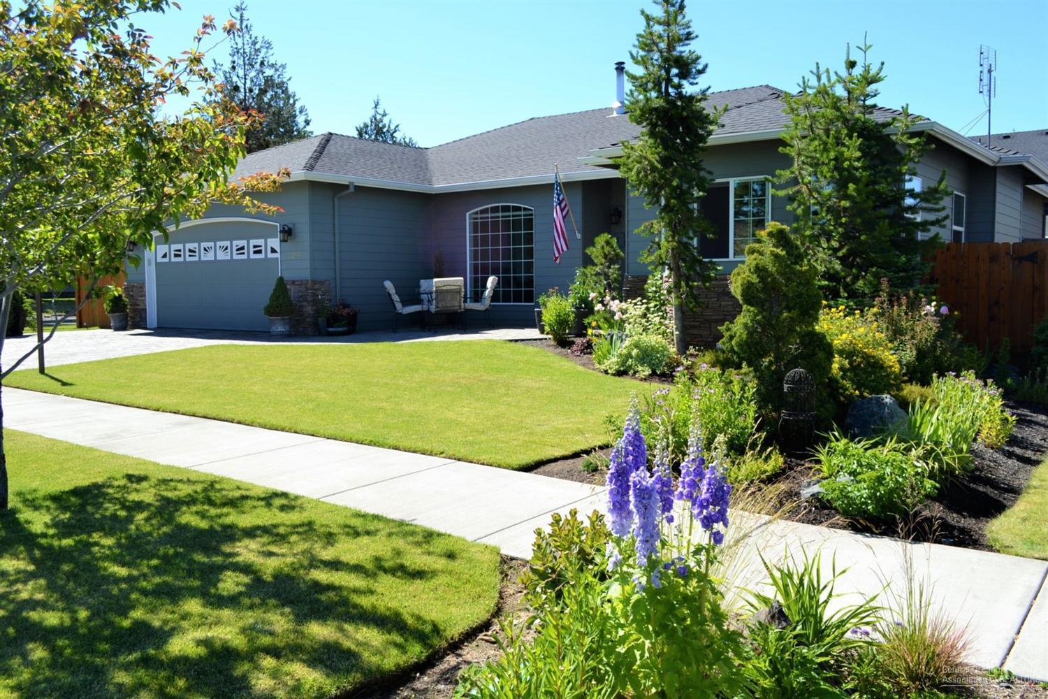 This well maintained home has a bright, open floor plan. Living room is complete with both a wood stove and gas fireplace. Beautiful walnut floors in kitchen and dining area. The kitchen has alder cabinets, granite tile counters and newer stainless appliances. Spacious master suite with walk-in closet, tiled double vanity, jetted soaking tub and large separate shower. Home wired for backup generator. Outside boasts a beautifully landscaped yard, covered patio, storage shed and gazebo with a hot tub!