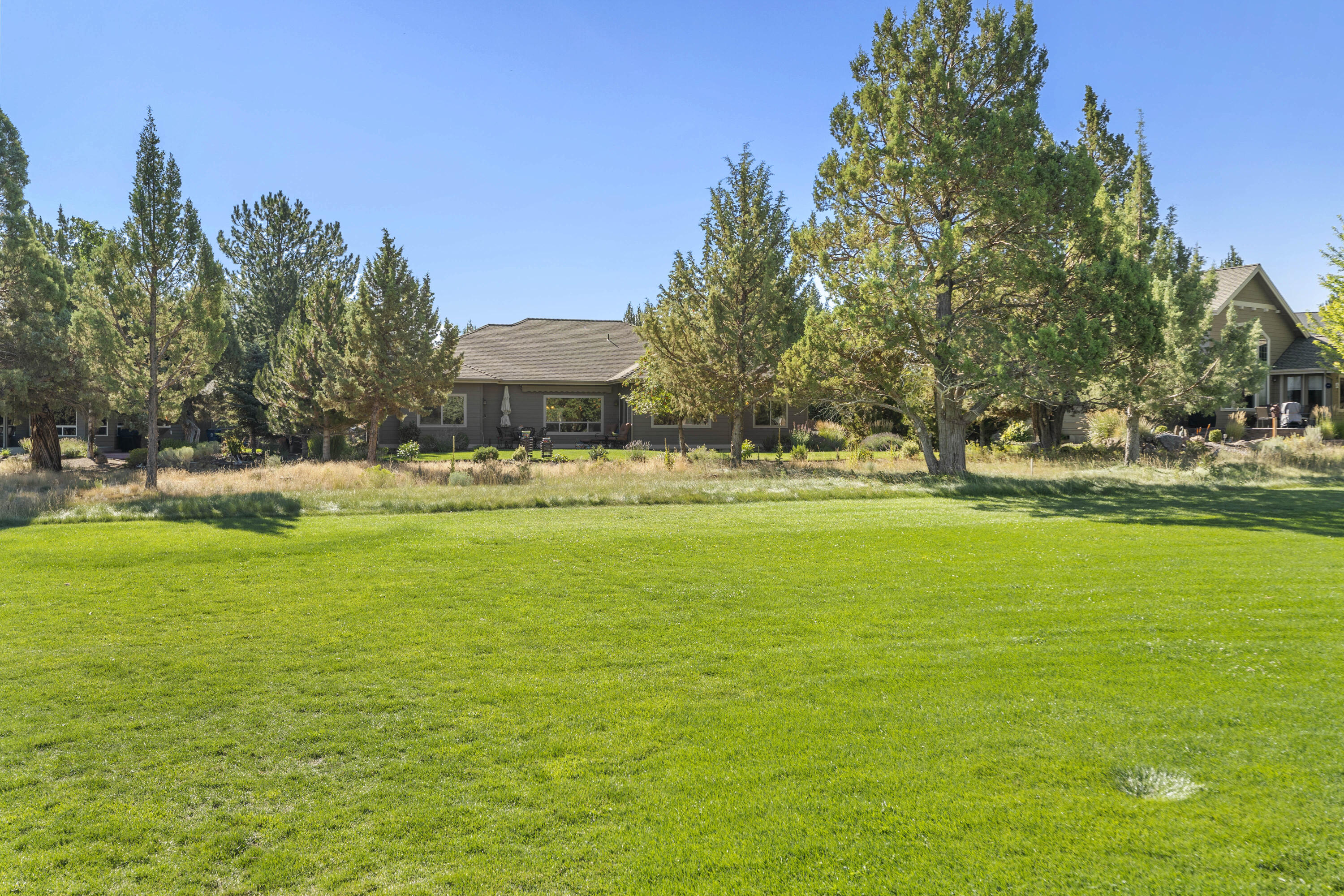 $50K price reduction! Beautiful SINGLE LEVEL home strategically situated fronting the golf course with panoramic views of the fairway in Eagle Crest! This very well kept home is in meticulous condition and offers an open Great Room floor plan with patio access to enjoy the outdoors whether it's rain or shine from underneath the power awning. A large, oversized granite kitchen island provides an abundance of room for your inner chef as you enjoy the stainless appliances, hickory cabinets, walk in pantry and gas range. Large Mstr. BR suite offers a dual vanity, walk in tiled shower, separate soaking tub, and walk in closet. This home boast of a large 3 car garage, a dedicated office near the entry, a laundry room, and a jack and jill style bath. If you are considering Eagle Crest, this golf course home is priced to move and a must see!