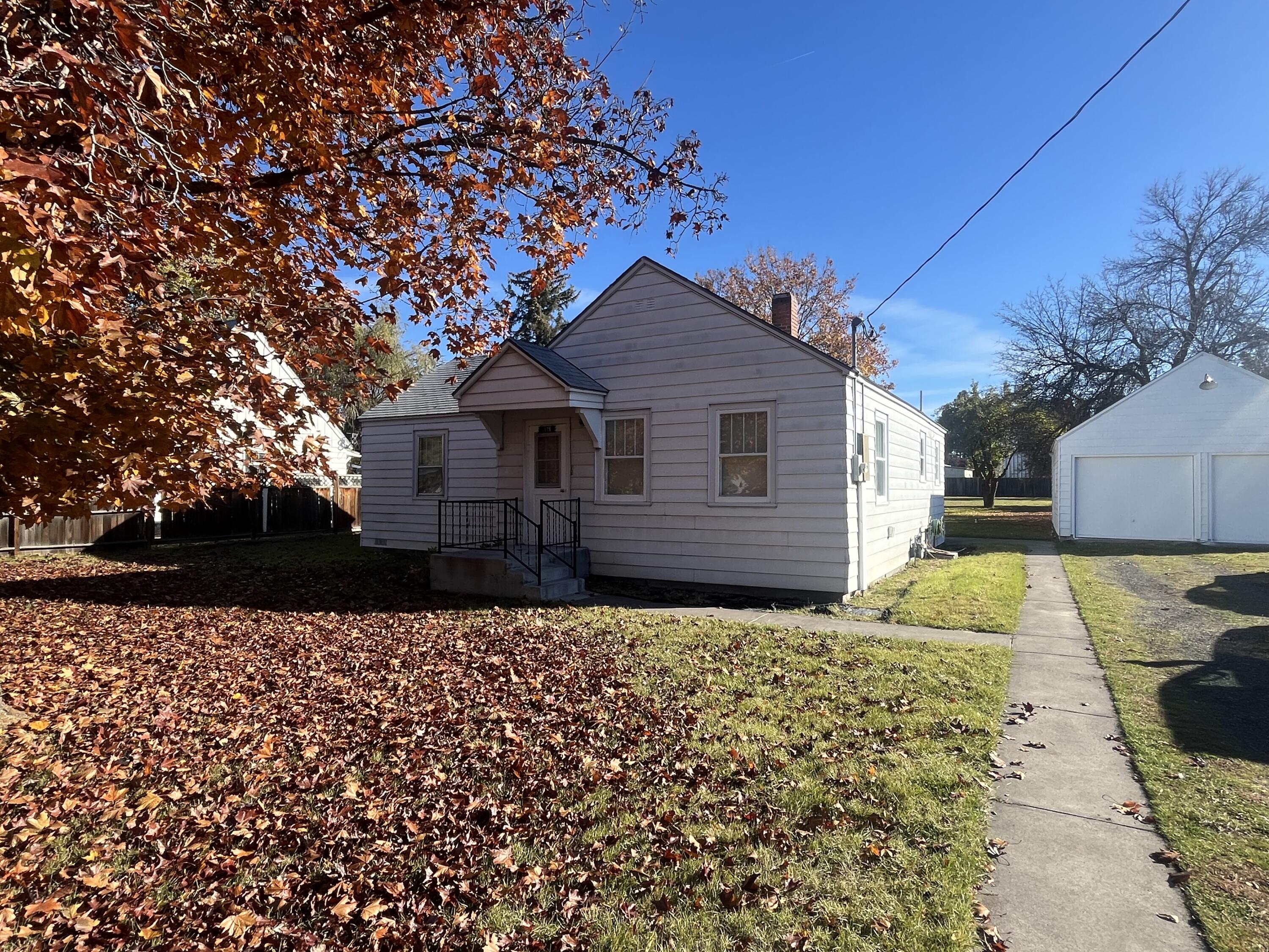 Don't miss this beautifully maintained 3-bedroom, 2-bath home built in the 1920's. Situated on a generous 0.44-acre lot, this property offers plenty of space for outdoor living. Featured include a detached garage and an additional outbuilding ideal for use as a cold room or extra storage. Classic character throughout with modern comforts makes this home a must see!