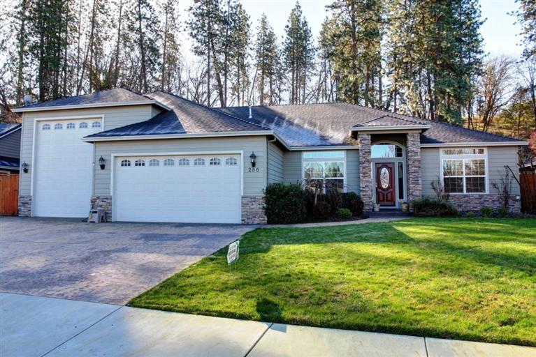 Rare Find! Completely Custom Built Single Level Bob Fellows Constructed One Owner Home. Huge 46 ft length, 11 ft wide, & 14 ft high finished RV barn attached w/full RV hook ups! Plus additional shop behind RV barn w/heat/air & stairs to big storage room above shop. Plus a finished 2 car garage. Behind the back yard is the most amazing, extremely private treed wilderness. Enjoy country living in a great neighborhood surrounded by newer homes just minutes to town. Split floor plan, granite countertops, tile flooring, upgraded carpet/pad, stainless appliances w/double oven + cook top, large master suite w/double coffered ceilings, walk-in shower-2 sinks-walk-in closet-private door to back yard, custom cabinets w/extra storage, large living room w/gas fireplace & rock surround, large formal dining room w/coffered ceilings, grand entrance, stamped concrete, covered front & back porch, beautifully landscaped front & back yards w/timed sprinklers & raised garden beds & fully fenced back yard.