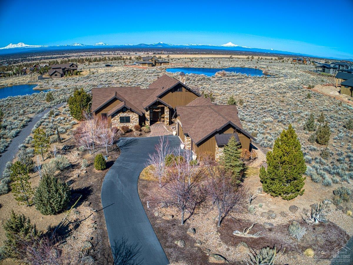 Warm and inviting home with gorgeous custom stone work on the exterior and panoramic Cascade Mountain views off the back patio. <br><br>This home features dark wood and beautifully textured walls with many upgrades throughout, no detail is missed. The Master Suite is a peaceful oasis to relax and unwind with lovely views of the mountains and a walk-in closet. The Master bath features a double headed shower with tile floors and countertops. In the daylight basement, you will find an office, media room and kitchenette perfect for entertaining guests. As you enter the home through the garage, you are greeted by a spacious mud room ideal for all your necessities to help get you out the door. You will love the granite island and high end stainless steel appliances in the kitchen. The outdoor living space is stunning with a covered patio, lovely landscaping and unending views. <br>