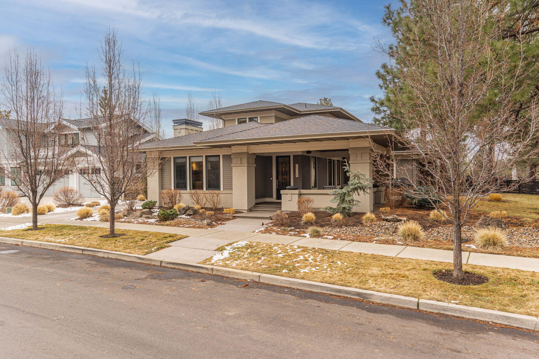 Welcome to this stunning custom-built home located in the highly desirable neighborhood in NW Crossing. Situated on a spacious .34 acre lot, this property has one of the largest lots in the neighborhood. Freshly painted interior with contemporary features including an inviting great room with hardwood floors, a gas fireplace, and custom built-ins. The kitchen is spacious with a large island, quartz countertops and JennAir appliances. The main floor includes the primary bedroom with a luxurious en-suite and a large laundry room. Upstairs offers two bedrooms, a full bath, and a loft area. Step outside and immerse yourself in the beauty of your oversized landscaped backyard or enjoy the covered courtyard offering additional outdoor living space for your relaxation and entertainment needs. The 3-car garage has epoxy floors and plenty of room for your vehicles and toys. Don't miss your chance to own this exceptional property in NW Crossing close to trails, restaurants, schools and more!