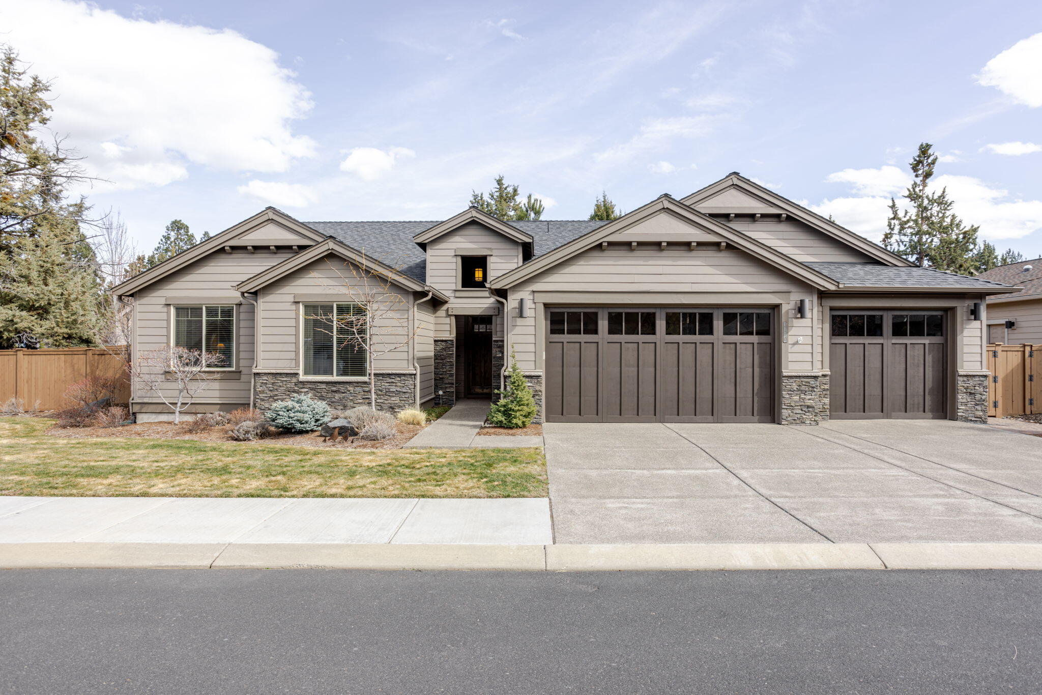 Single level home in the gated community at Rivers Edge Village located across the street from the beloved River Trail. 2002SF / 3 bedrooms / 2.5 bathrooms / .21 corner acre lot / built in 2014. Nice bedroom separation with large Primary suite. Great room with expansive windows, vaulted ceilings & stone gas fireplace with built-ins. Open kitchen with quartz counter tops, engineered hardwood floors & SS appliances. Walking out from the dining room onto a large, covered patio with a water feature & beautifully landscaped yard & gardeners shed. The 3-car garage with ample attic storage completes this wonderful home!