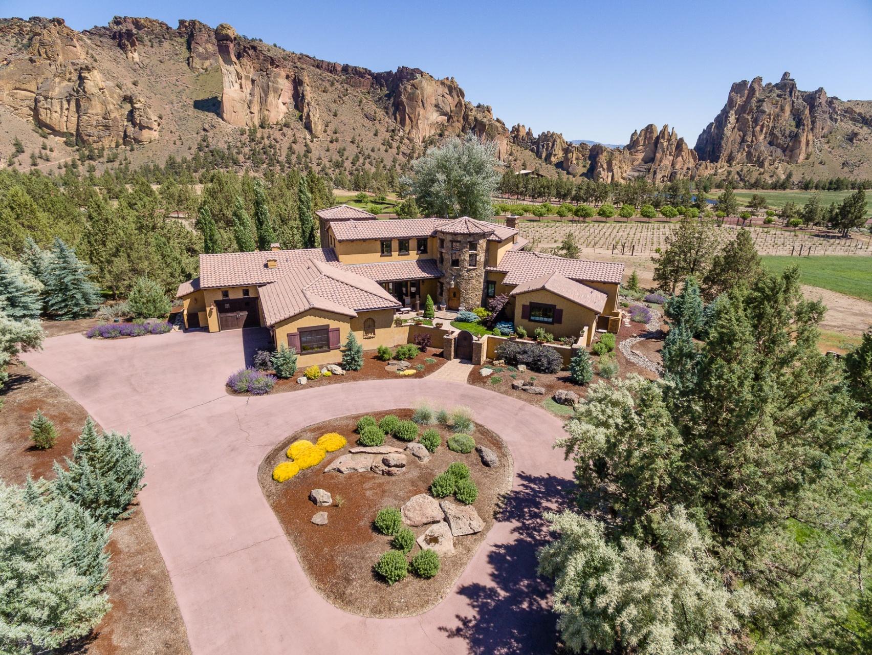 Gorgeous Norman Building and Design home situated perfectly above the vineyards at Ranch at the Canyons. Welcoming courtyard entrance leads to impressive views of Monkey Face, Smith Rock and the vineyard from every room of the home. Main floor features a spa like master retreat with Cascade Mountain views, guest suite and office. Impressive great room with rock fireplace. Walk up the graceful stairway to another guest suite with access to a deck with stunning views and a bonus room with a professional pool table . Ranch Amenities: 1700 acres of meadows, farm, vineyard, river canyon, hiking/biking trails, clubhouse, pool, stable, arena, stocked ponds & Cascade Mtn Views. This is the perfect retreat away from a crowded, stressful life!