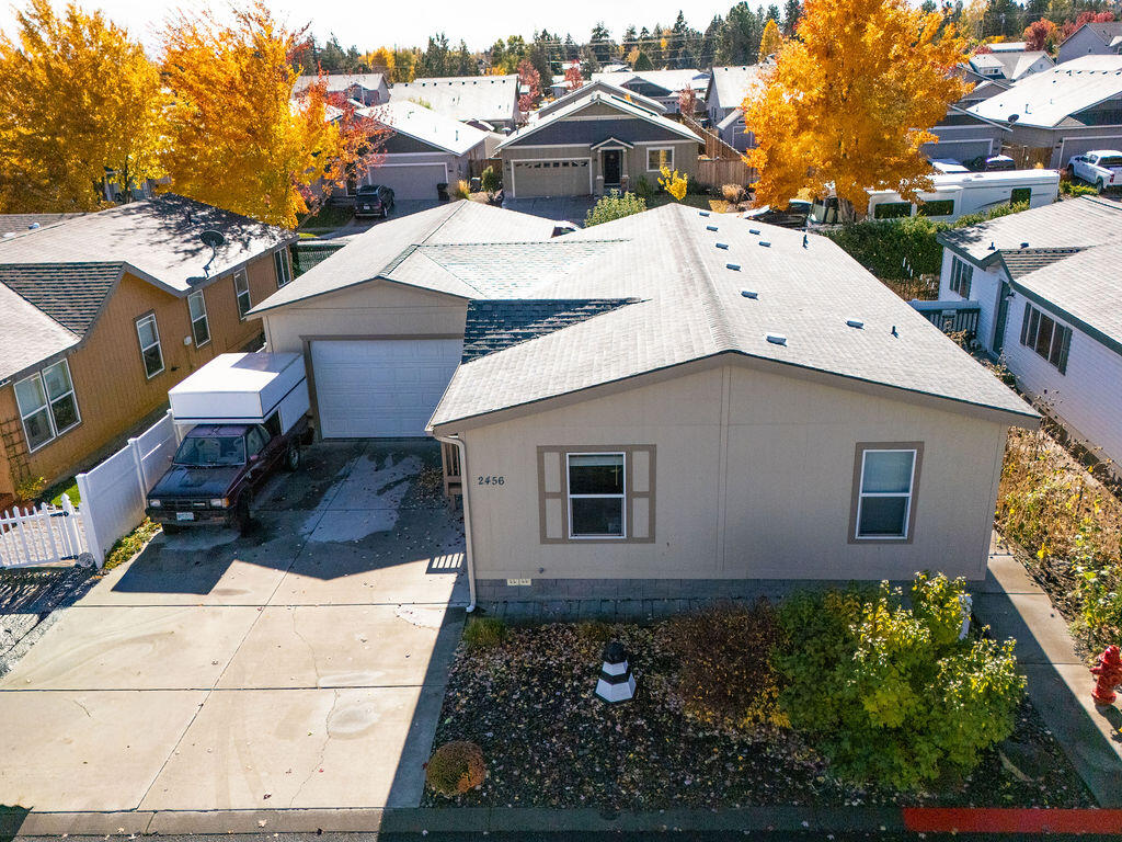 This 1,296 sq foot manufactured home is strategically located in Redmond, allowing quick access to schools, shopping and dining out. The home features three bedrooms and two bathrooms, along with several new upgrades. Recent improvements include a new heat pump furnace & AC, deck, shed, door and  fencing. Landscaping enhancements comprise of mature trees with a beautiful yard. The garage/shop is ideal for hobbies, and the backyard's raised beds are perfectly sized for a family garden. HOA Benefits include Clubhouse access, snow removal, and water/sewer.  Don't miss out on this amazing home!