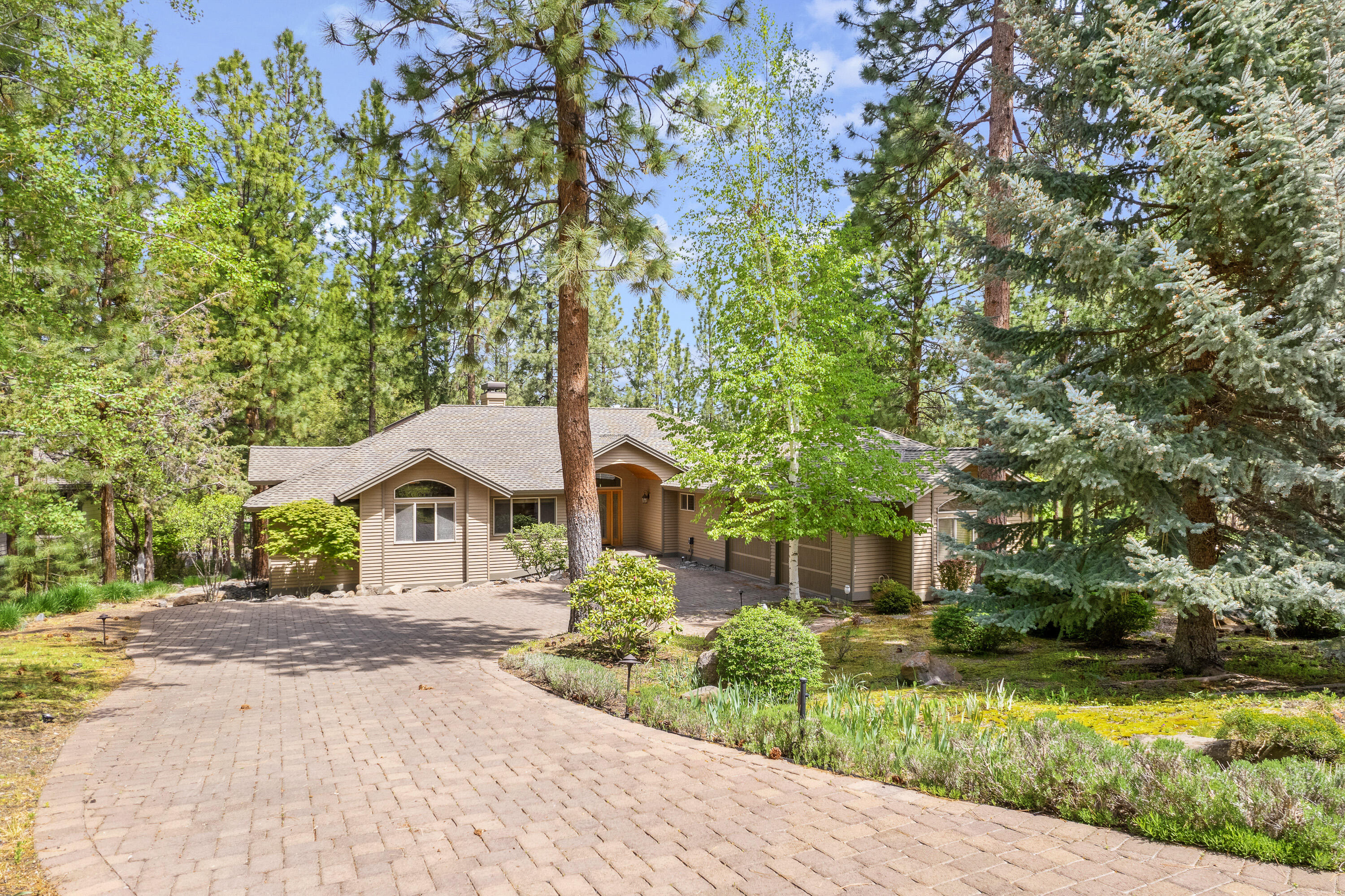 This is one of the best locations Awbrey Glen has to offer and is located amidst the 4th, 14th and 16th holes with remarkable views and privacy. It is a beautiful, single level home built by Norman Building offers many of their signature features; vaulted wood ceilings, Oregon stone fireplace, quality built, openness and abundance of natural light throughout the home. The kitchen was completely remodeled within the last 6 years; includes a double oven, warming
drawer, pantry, sliding cabinet drawers and more. The laundry room was designed with additional workspace and comes with a fairly new Speed Queen washer and dryer. 3 bedroom, 2 bathrooms, 2441 SF, .31 acre, oversized 2 car garage, large paver driveway, fully landscaped. Come see this gorgeous, amazing and well cared for home today!