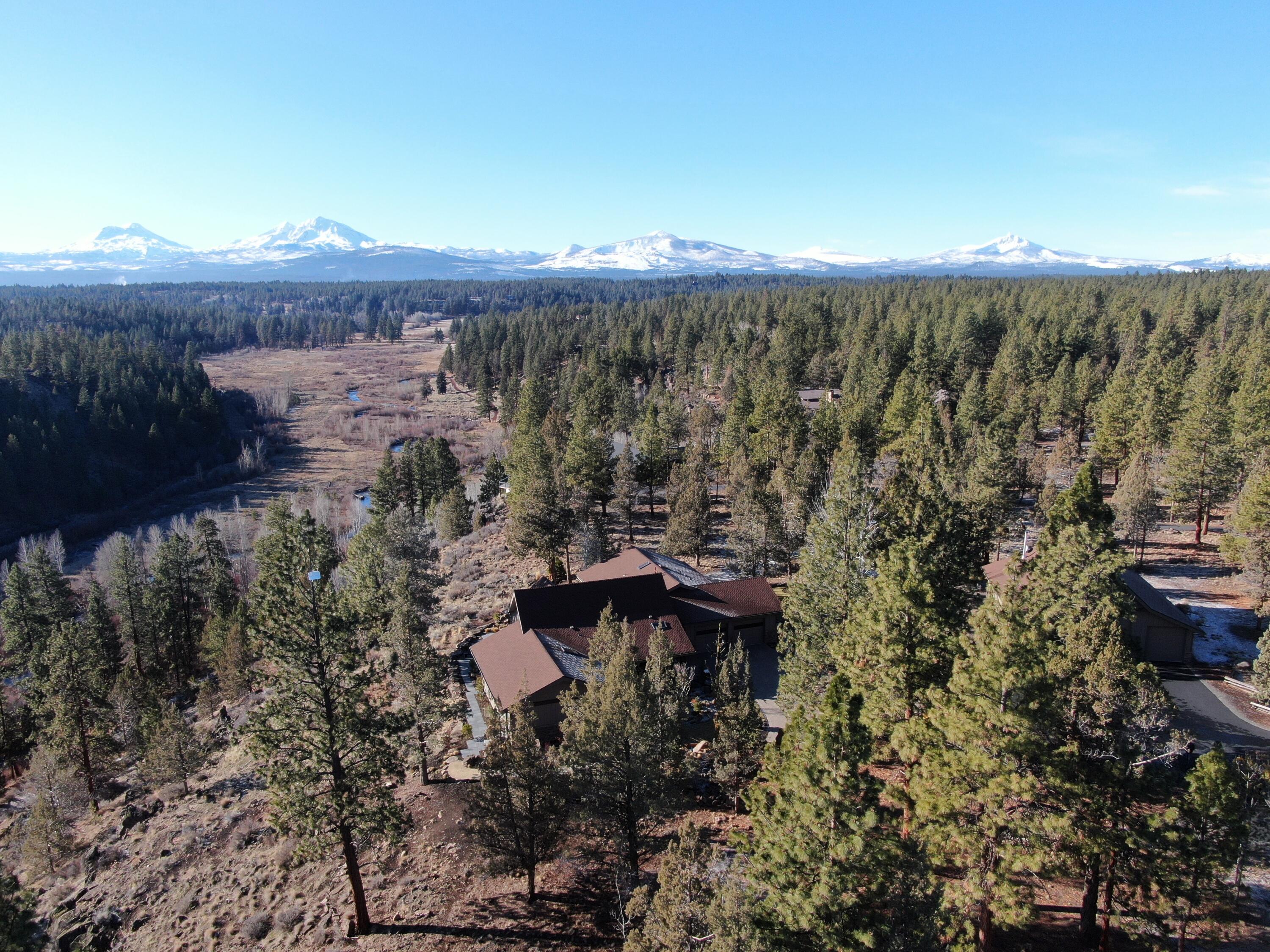 This home was thoughtfully, intentionally renovated and professionally landscaped, focused on the magnificent Cascade Mountain Views! This single level home provides abundant natural light and mountain views throughout the home. Separation between the Master Suite and the additional two ensuite bedrooms provides privacy and a spacious feel. The open concept main living space includes a large dining area, comfortable breakfast area, updated kitchen with premium appliances and an expansive living area that fully captures the canyon, Whychus Creek and Cascade Mountain Views! The outdoor living space provides many different options with two plumbed propane fire pits, a built in BBQ, expansive seating area and a built in hot tub! The RV barn includes guest quarters with full bath, washer and dryer an RV area currently utilized as a game room, and a separate garage bay that can accommodate multiple vehicles. Truly a turn key property in every sense of the word!