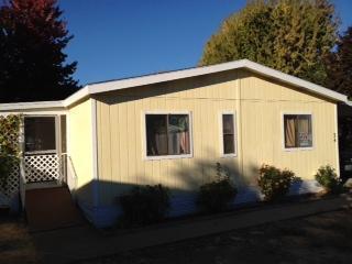 Located in a gorgeous 55+ park in very desirable cul-de-sac location, just outside of Phoenix. Home has 3 bedrooms, 2 baths with split floor plan. New roof in 2007 and new HP in 2004, sound structure. Could use new carpets, some minor repairs, and interior paint, a diamond in the rough. Large fenced yard with mature trees, covered deck and small storage shed. Bring your paint brush and build immediate equity!