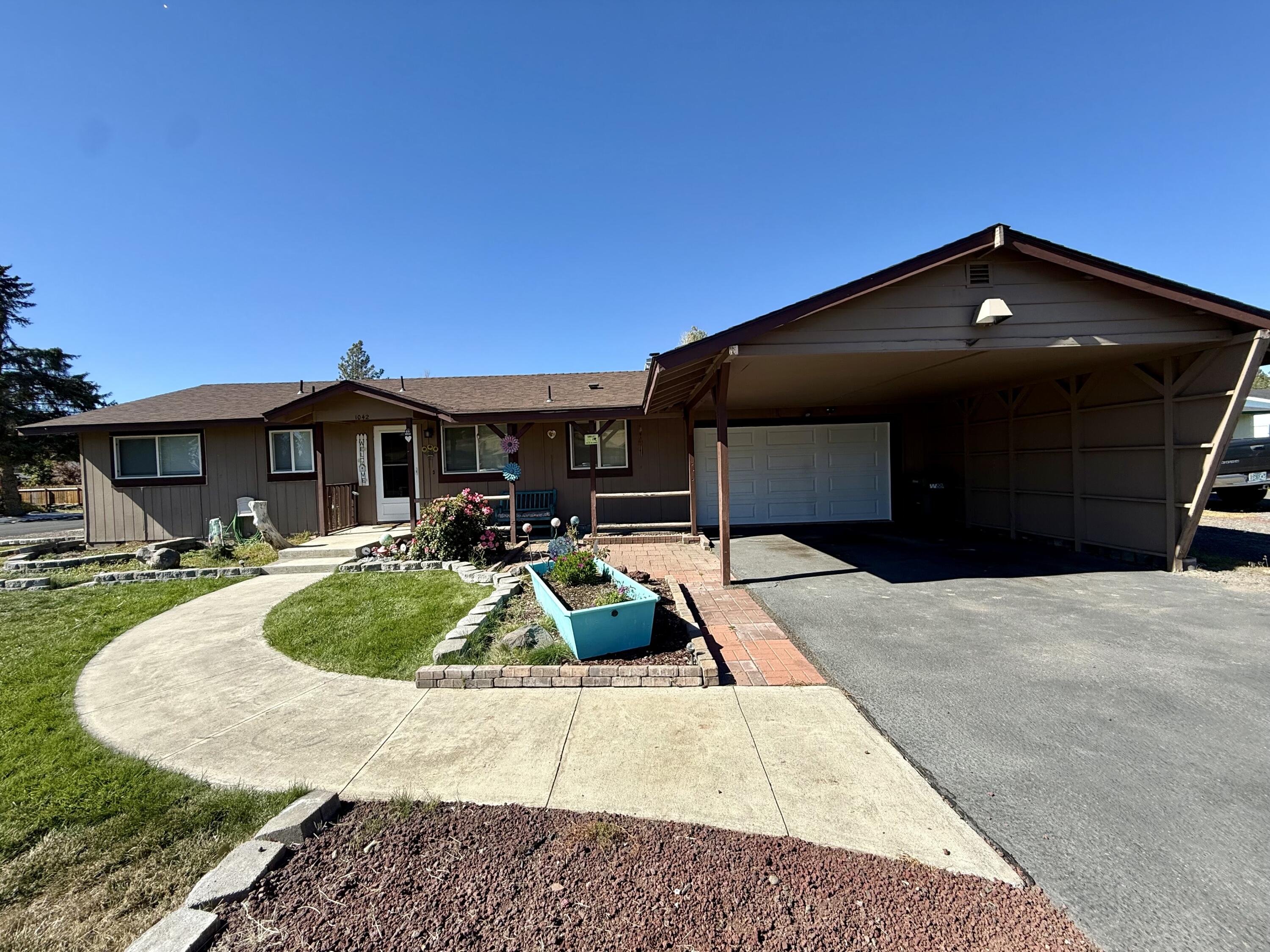 Tastefully Updated home! Come see this beautiful 3 bedroom 2 bath home that features Granite Countertops, Updated Kitchen. Updated Bath, Roof is approximately 9 years old, Newer furnace, Certified Wood Stove insert, Updated Windows and Central Air, Heated Garage and Laundry Room. Underground sprinklers in both front and
back yard. The Hot tub is included and has been drained and winterized.  Located conveniently close to shopping! All of this on a beautifully landscaped large corner lot.
