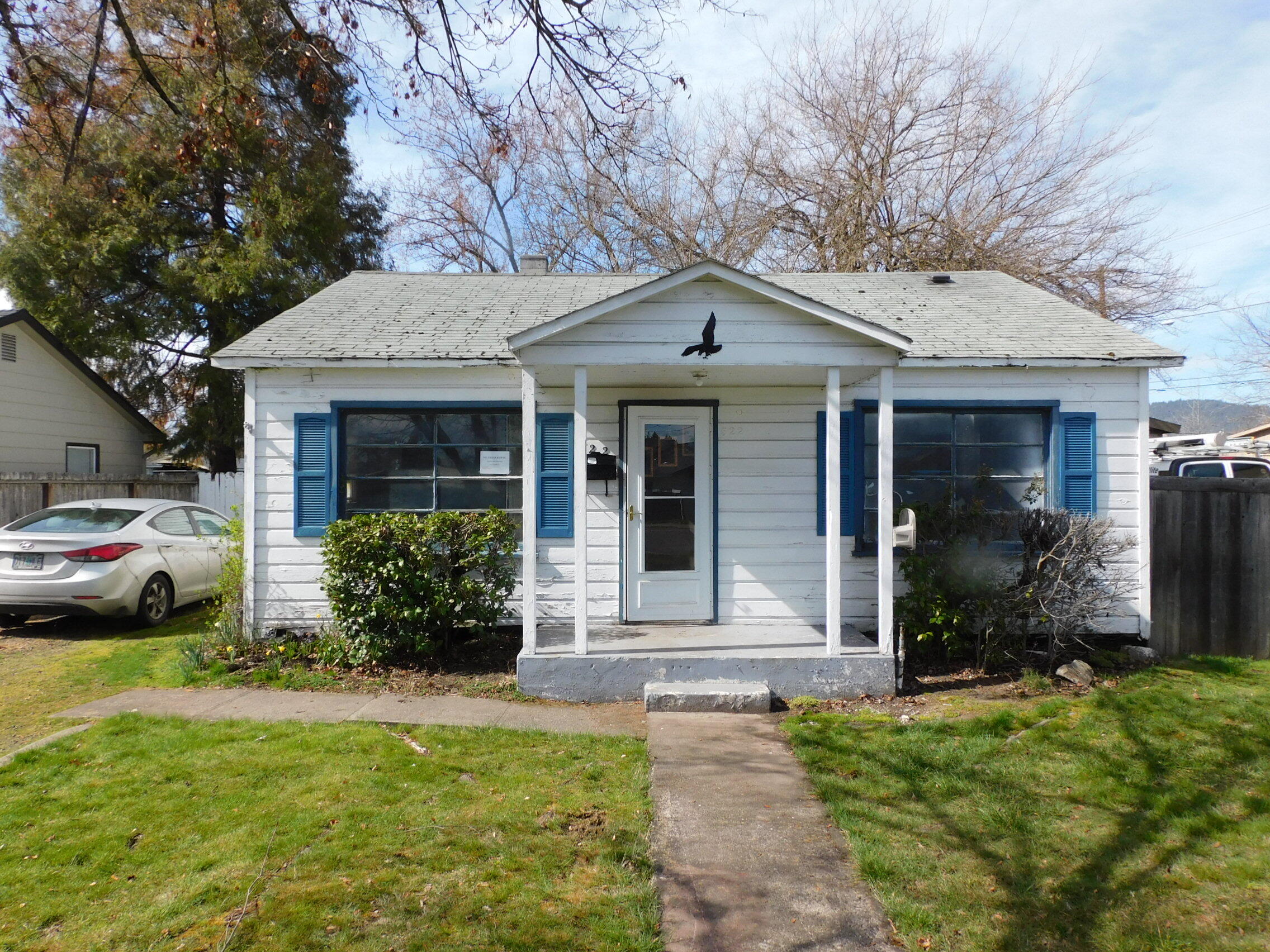 Outstanding price! No listed comparable property in Central Point has been priced for less in over two years! This cottage was with the previous family for around 50 years or more. Hardwood floors could be made to sparkle again. Gas furnace covered cement patio. The garage has lots of built-ins and a work space. The backyard is fenced. Just a walk to the park and Central Point Elementary school. See Instructions.