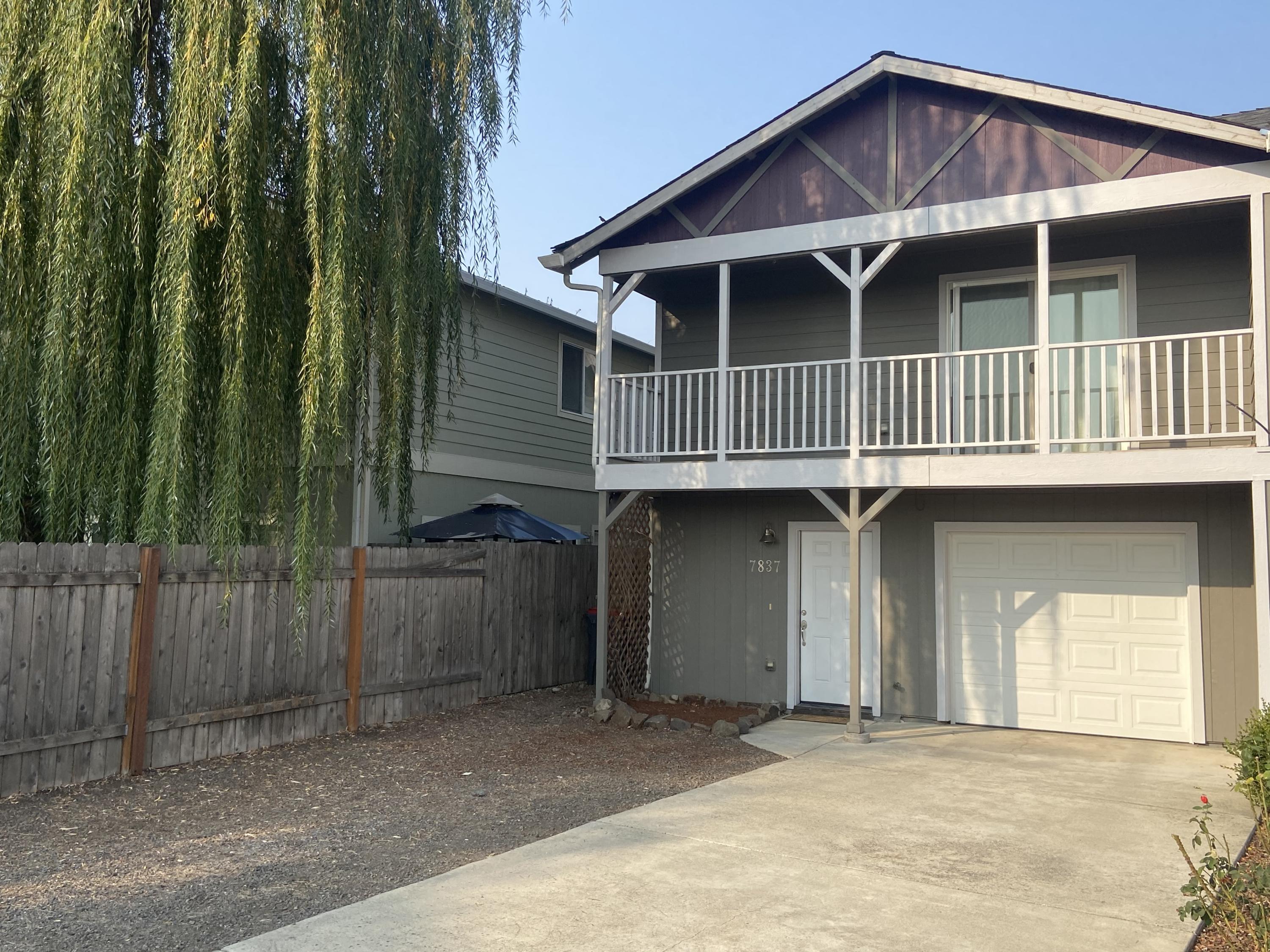Great Floorplan and location make this 2 story home with small fenced yard plus a covered balcony off of the living area a home not to miss out on. The Kitchen, Dining area and Living area have laminate floors and vaulted ceilings to give the home a nice open feel.  The master is on the main floor while two other good size bedrooms are downstairs with the laundry area and a full bath.  There is also extra parking to the side of the driveway.  Great home for anyone in the market.  Call to schedule your appointment today.
