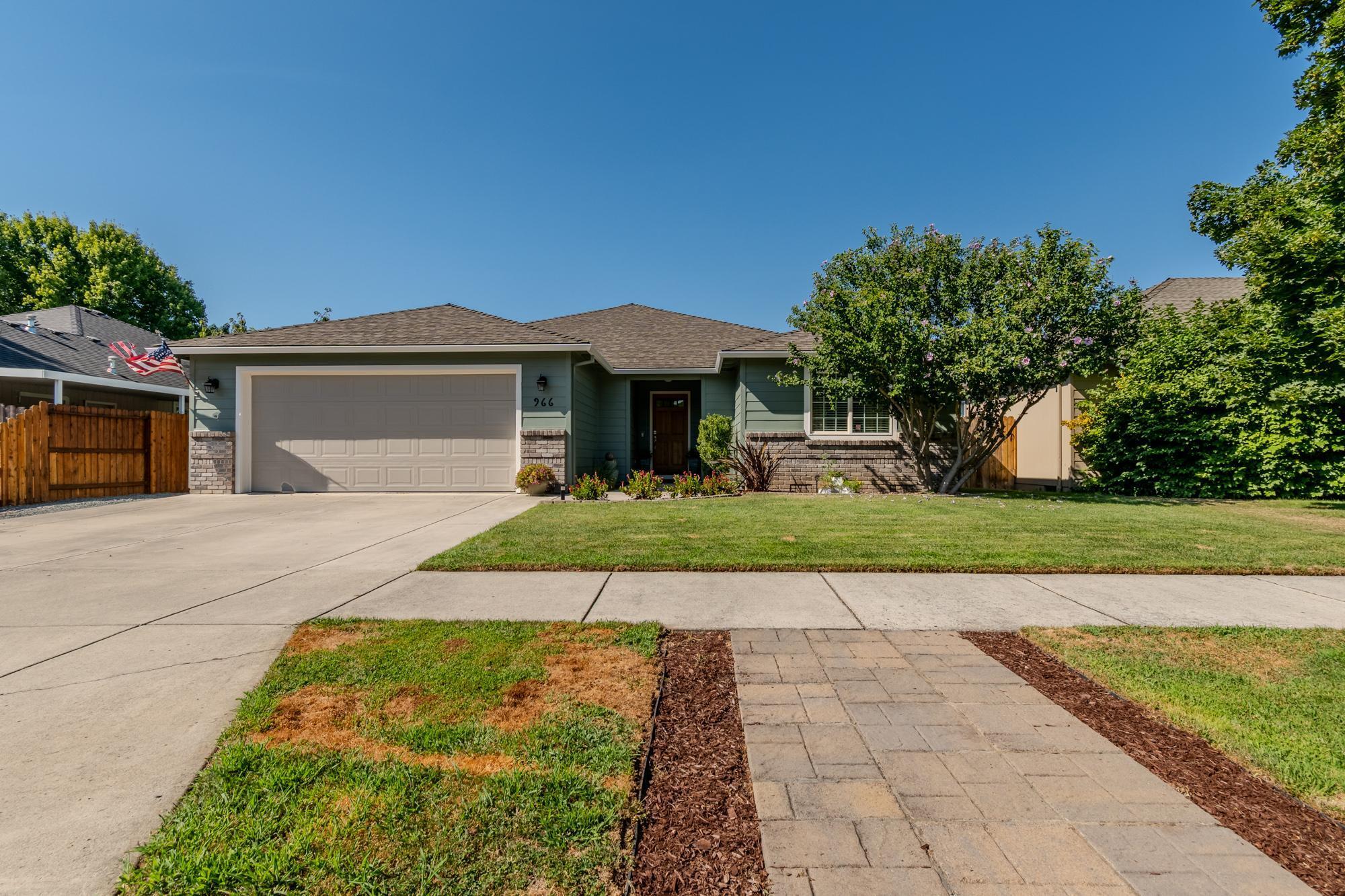 Beautiful home in the sought after Hampton Place Subdivision.  Split floor plan with New engineered flooring and new carpet in the bedrooms, freshly painted inside and out. Large Master suite with access to back covered patio, garden tub and double sinks in master bath. Both bathrooms have been updated. Large living room with gas fireplace for those cold winter days.  Roomy kitchen with lots of cabinet space and breakfast bar. Dinning area has a bay window that views out on the nice yard & covered patio with gas connection for BBQ.  Oversized garage with work bench  Home is a pleasure to view.