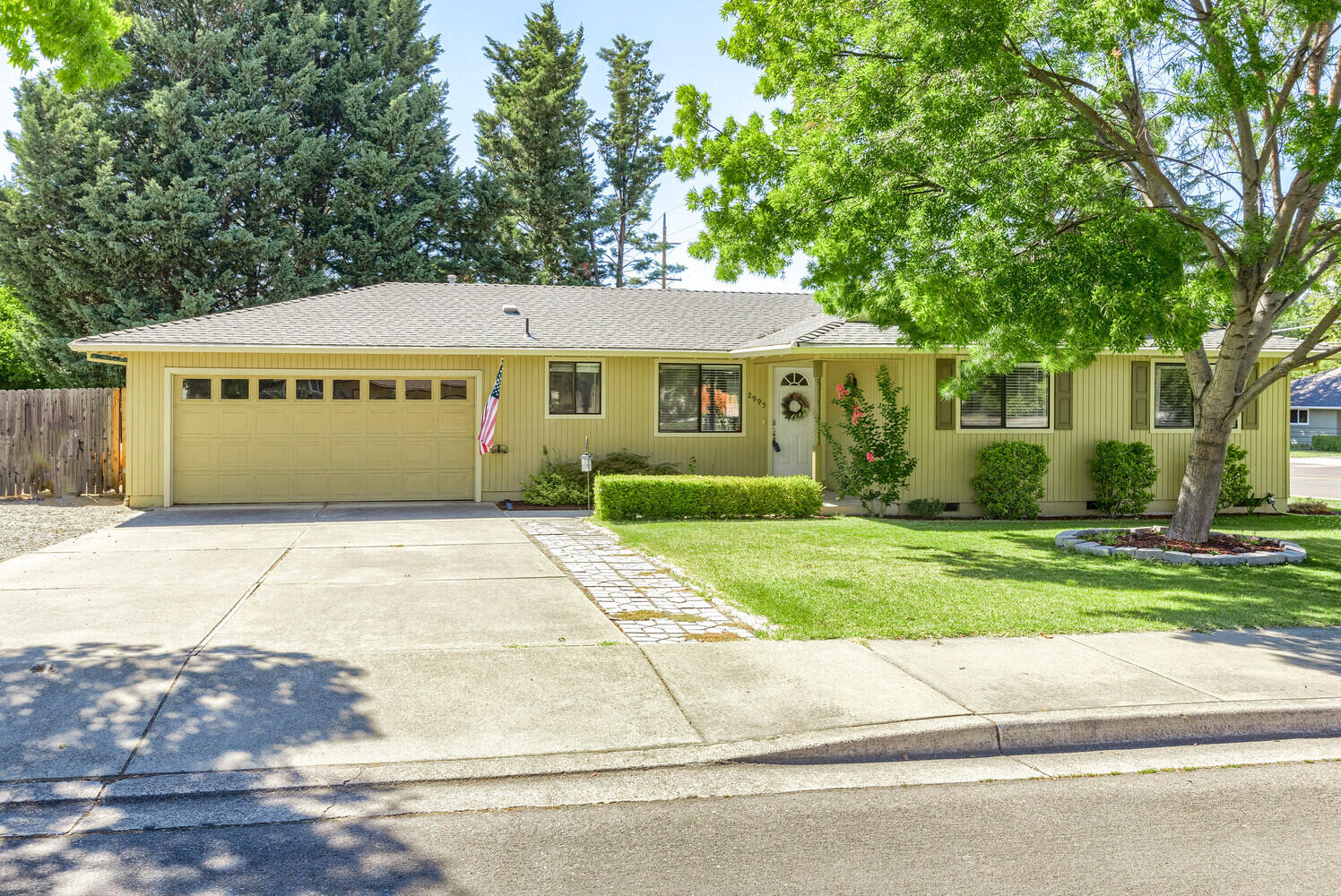 Nestled on just over a quarter of an acre with RV parking, this tastefully updated home exudes the perfect balance of comfort and charm. The inviting foyer welcomes you home as you step inside on laminate flooring which flows throughout the main living areas and the three bedrooms. The updated kitchen has beautiful granite counters, tile backsplash, and plenty of cabinet space! The primary suite is spacious and the updated ensuite has granite counters, tile floors, and step-in shower with tile surround and glass enclosure. The updated guest bathroom has granite counters with vanity area, and tub/shower with tile surround. A brick, wood-burning fireplace greets you as you enter the main living space with formal dining area and sliding door access to your expansive patio. The oversized backyard has mature trees, large deck, storage shed, hot tub, and a spacious grassy area. Conveniently located to nearby shopping and restaurants, you will cherish this turn-key home for years to come!