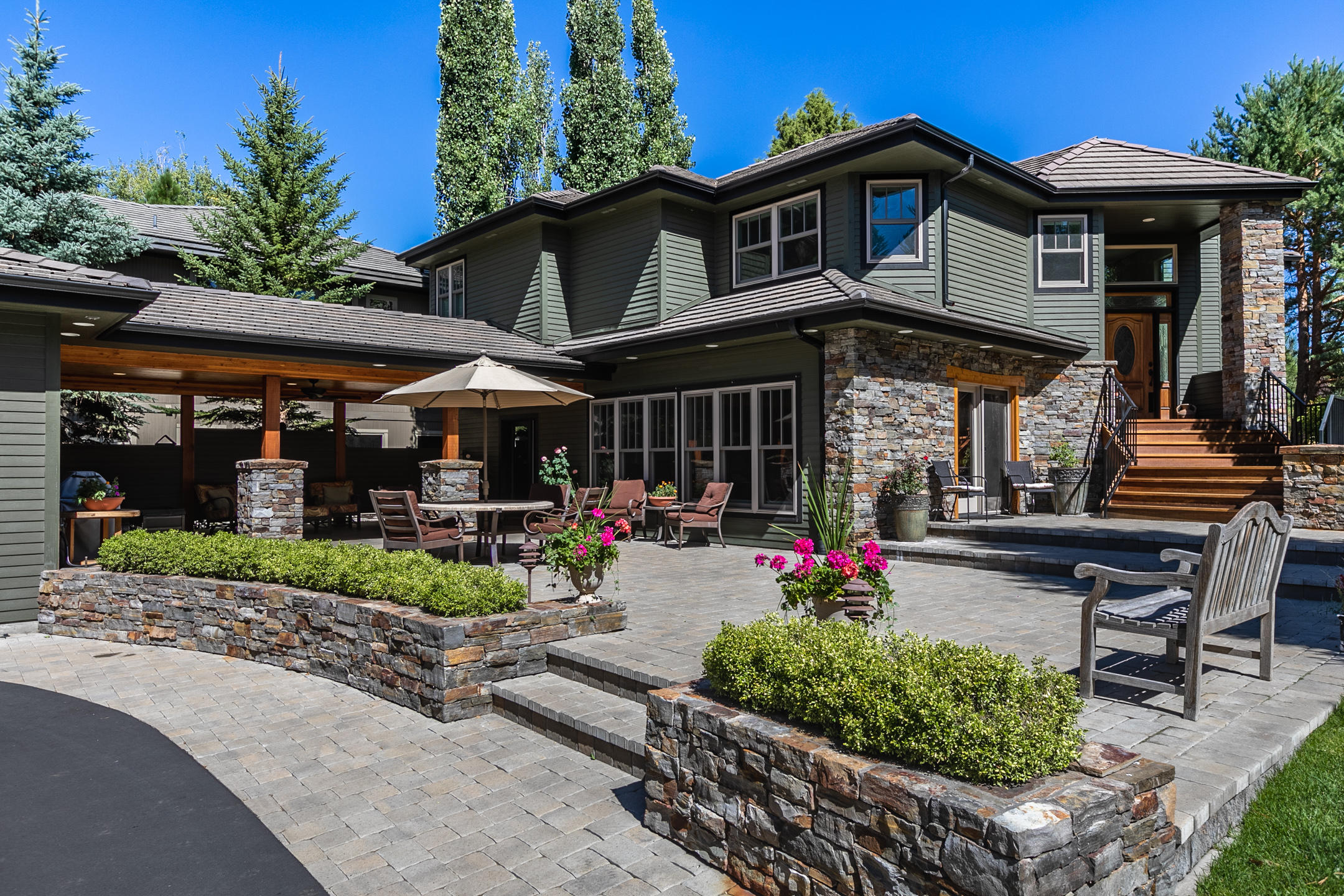 Impressive, light & bright NW contemporary style, 3321 sq. ft. home overlooking the 17th green in Broken Top. Open floor plan w/spacious living room, gas fireplace, wood floors, kitchen w/ Viking stove, Fisher Paykel dishwasher, red birch cabinetry, pantry. Master suite features walk-in closet, soaking tub, access to back deck. Lower level boasts 2 bedrooms & a large family/bonus room w/a wall of windows, bringing in an abundance of natural light. Recent addition of a 1352 sq. ft. heated three car+ garage, complete w/a half bath, Baldhead custom built work bench, stainless steel dog bath/sink, tire racks, two 8' garage doors, one 9' door, two 240 volt electrical outlets, storage closet.  Entertain or relax on the elevated, wrap around back deck or on the beautiful, expansive south facing 1500 sq. ft. front paver patio. Enjoy Broken Top's wonderful amenities; miles of hiking and biking trails, the Club restaurant & with membership golf, tennis, pickle ball courts, pool & fitness room.