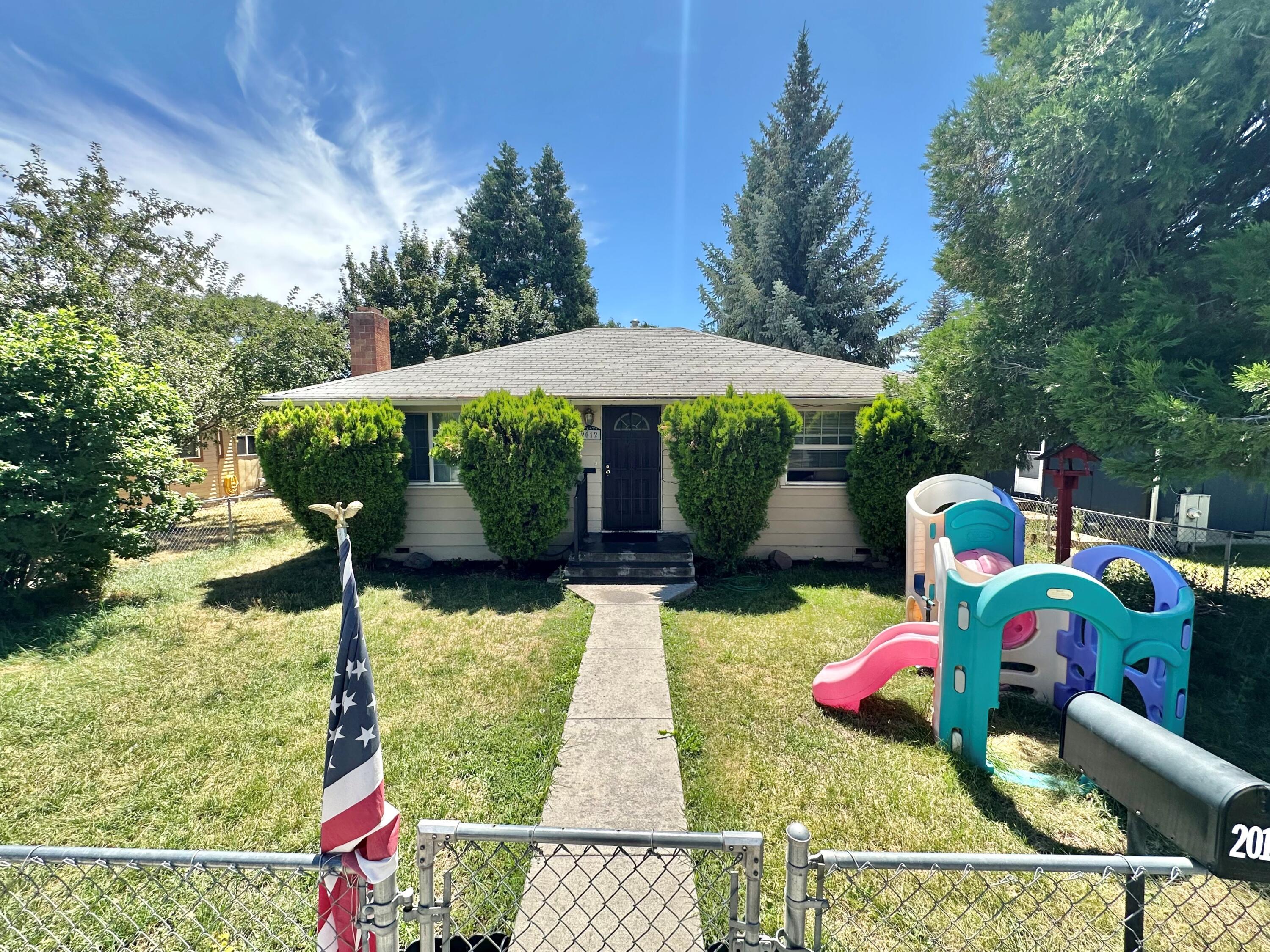 Two-bedroom 1 bathroom home with detached garage.  Home is set up nice and has had a consistent rental history.  Fenced with outbuilding and ally access from rear of property