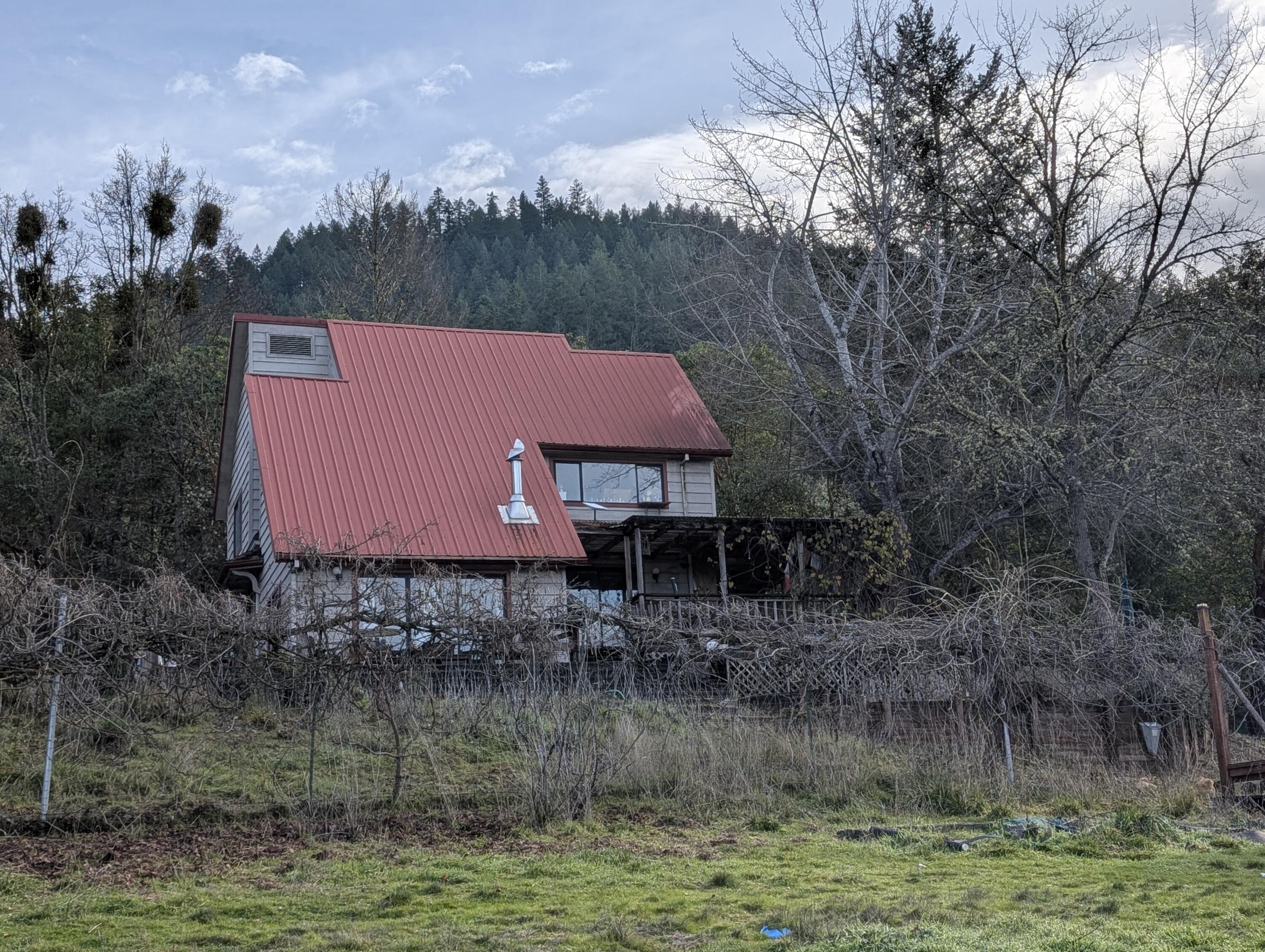 Discover your serene country retreat in Williams, Oregon! This charming 3-bedroom, 2-bath home is nestled on nearly 27 acres, offering unparalleled privacy and surrounded by majestic mountains. Perfect for equestrian pursuits, farming, or homesteading, this rural haven lets you embrace a self-sustainable lifestyle. Inside, enjoy a cozy, spacious layout, modern amenities, and plenty of natural light. Whether you're unwinding on the porch or exploring the vast landscape, this property is your gateway to peaceful rural living.