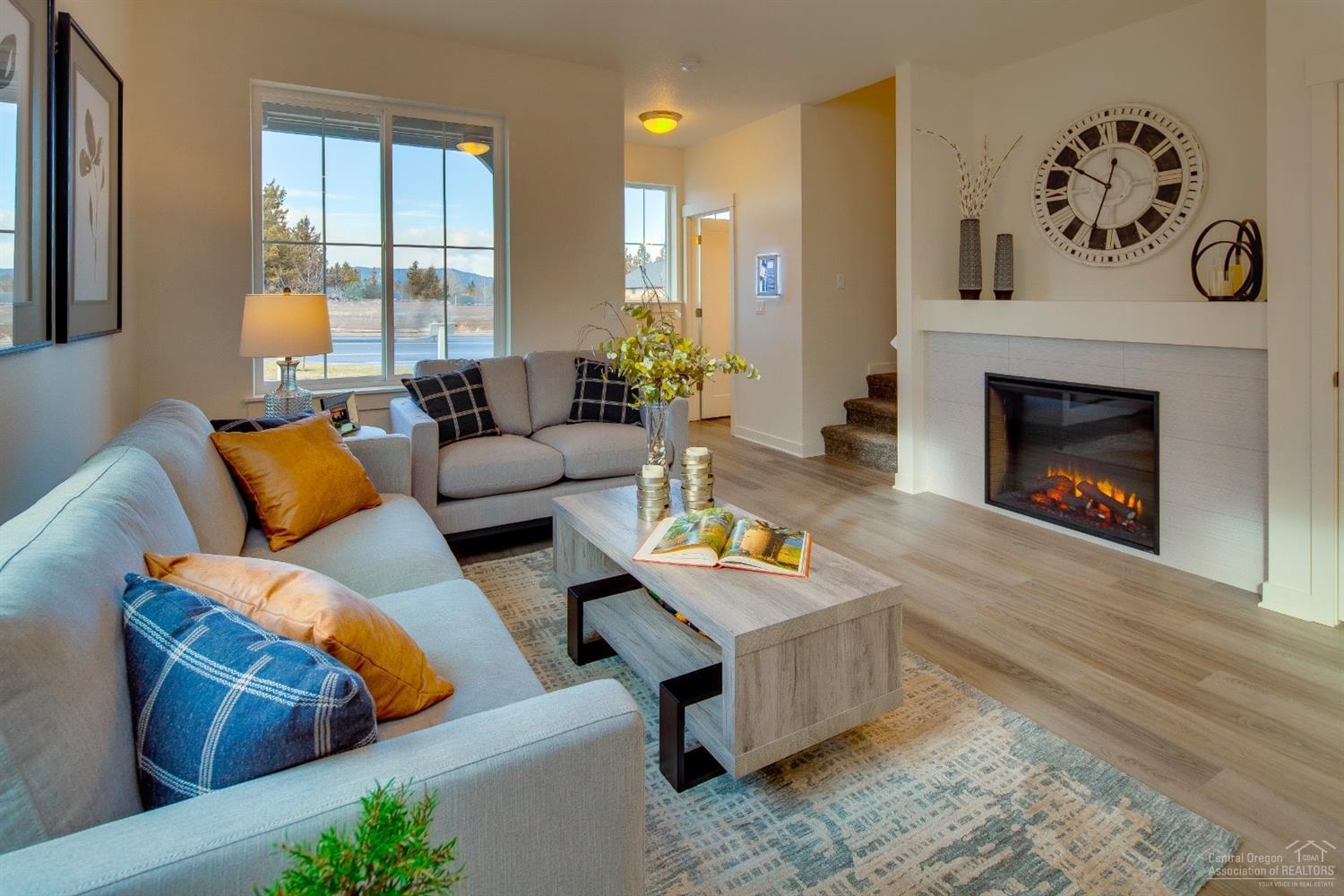 This Parkside (Right) plan is full of many quality finishes such as quartz counters through out, stainless steel appliances, A/C pre-wired, 2 car insulated garage, electric fireplace with blower, and a Loft upstairs for additional living space.This home is an end unit with sliding glass door leading to fenced side yard. Residents enjoy the proximity to shopping on the east side of town and access to Highway 20. Nearby schools, parks, restaurants and medical facilities are just minutes away. Purcell Landing is the perfect neighborhood for those who want to lower their carbon footprint and have ample outdoor time in beautiful Central Oregon.*Virtual Tour is an example of layout and floor plan, not of actual home. Located on the Northeast side of Bend behind St. Charles Medical Center. Take 27th St. to Courtney. Come see why Pahlisch has won 150+ Quality & Value Awards! Photos of similar home, specs vary. Model located at 2582 NE Purcell Blvd. Bend OR 97701.
