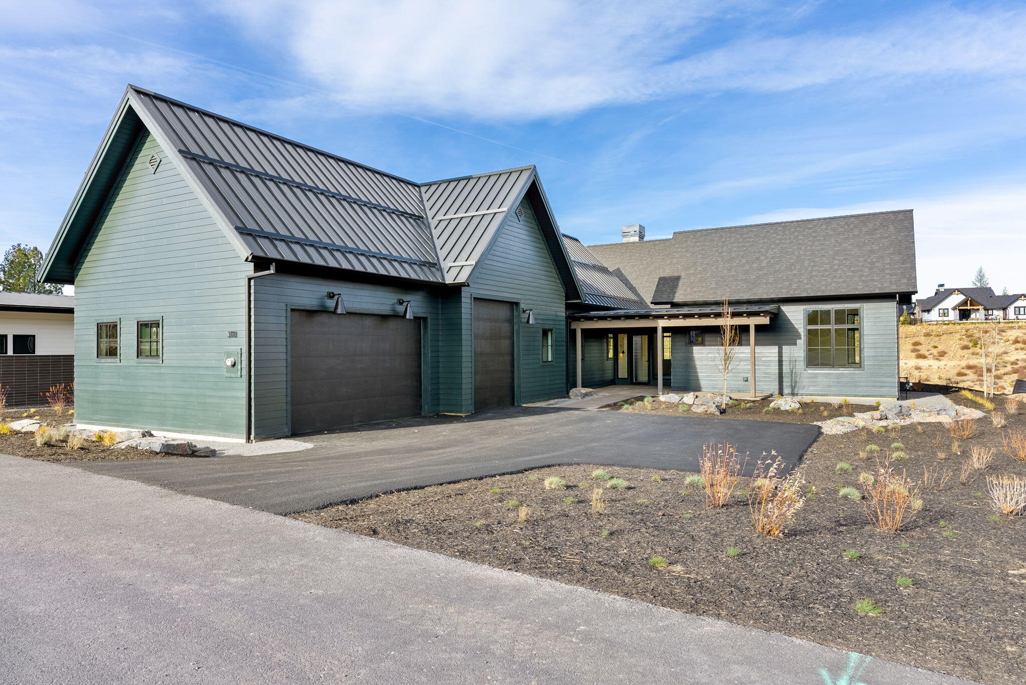Step into this stunning, single-story contemporary farmhouse in Discovery West. Thoughtfully designed, this home masterfully blends nature, quality, and functionality with an air of elegance. Spanning 3,093 square feet, the open-plan layout offers 4 bedrooms, 4 bathrooms, a den, and a 3-car garage with an additional RV/Sprinter bay. The home stands out with its exquisite, high-end finishes throughout. Enjoy the warmth of radiant heat in the spa-inspired primary bath, stay cool with air conditioning on warmer days, and unwind on the private patio designed for easy living. Glass sliding doors lead directly to the Discovery Park trail system, making it easy to bike on Phil's Trail, grab coffee at Discovery Corner, or let your dogs roam free at the nearby off-leash park. Embrace the easy, comfortable lifestyle in this beautifully crafted home, ideally located near all the reasons we love living in Bend!