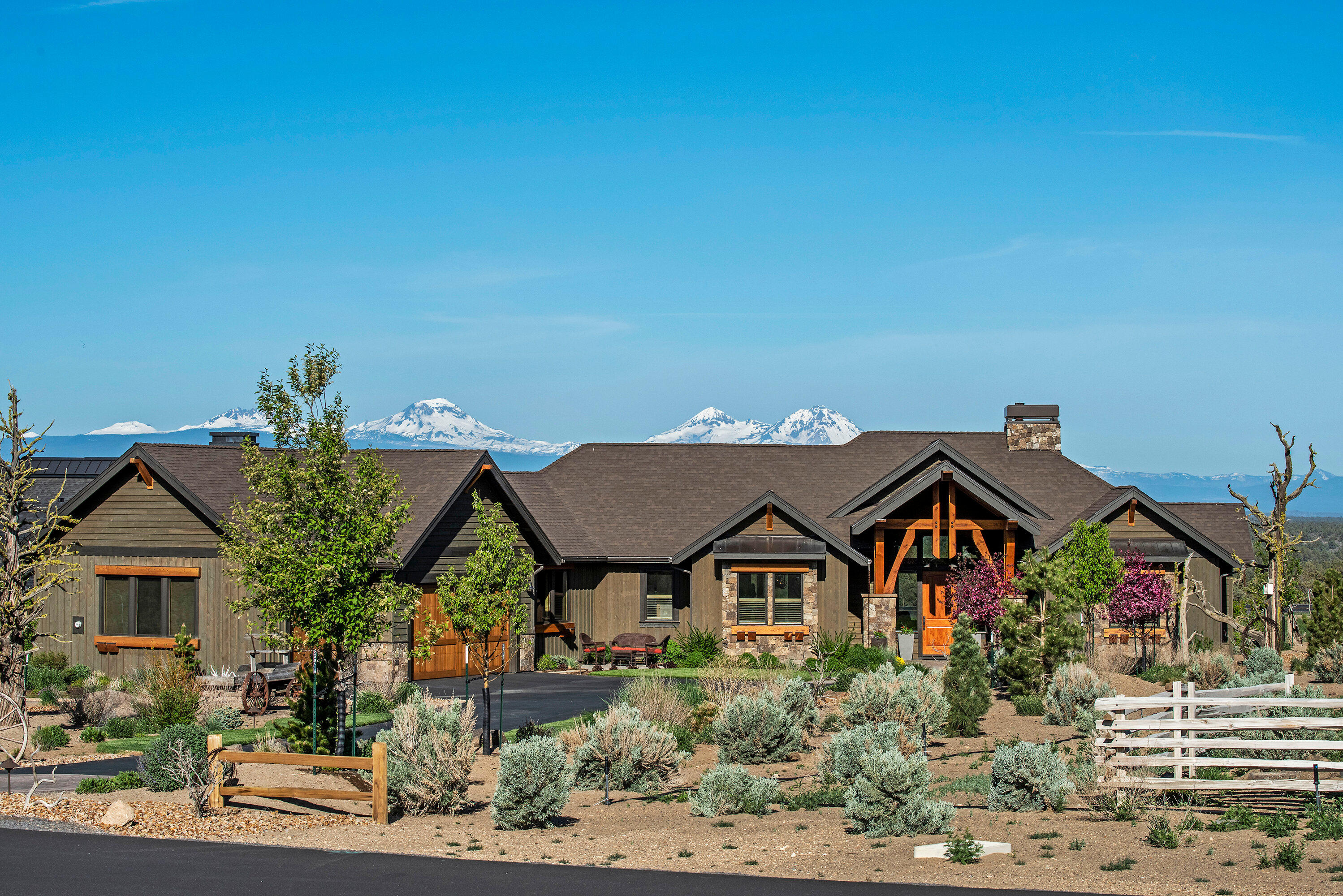 Stunning single-level custom home with spectacular, unobstructed panoramic view of the Cascade Mtns in the gated community of Brasada Ranch. Spacious open floor plan w/oak floors, vaulted ceilings, exposed beams, Pella wood windows, wine bar, gas fireplace & natural knotty alder cabinets. Dream kitchen features 6-burner gas stove top, double ovens, warming drawer, large island & granite counters. Master suite is complete w/walk-in closet, shoe closet & tiled bathroom w/soaking tub, walk-in shower & heated floor. Work from home in your spacious office w/two built-in workstations & double barn doors for privacy. Two guest rooms w/Jack & Jill tiled bath. Park your toys in the oversized heated 3-car garage w/cabinets, work bench & epoxy floor. Enjoy an expansive covered patio w/outdoor kitchen & gas firepit surrounded by a beautifully landscaped yard and 25 acres of open space. Minutes from Brasada's picturesque golf course, athletic center, restaurants, pools, spa & equestrian center.