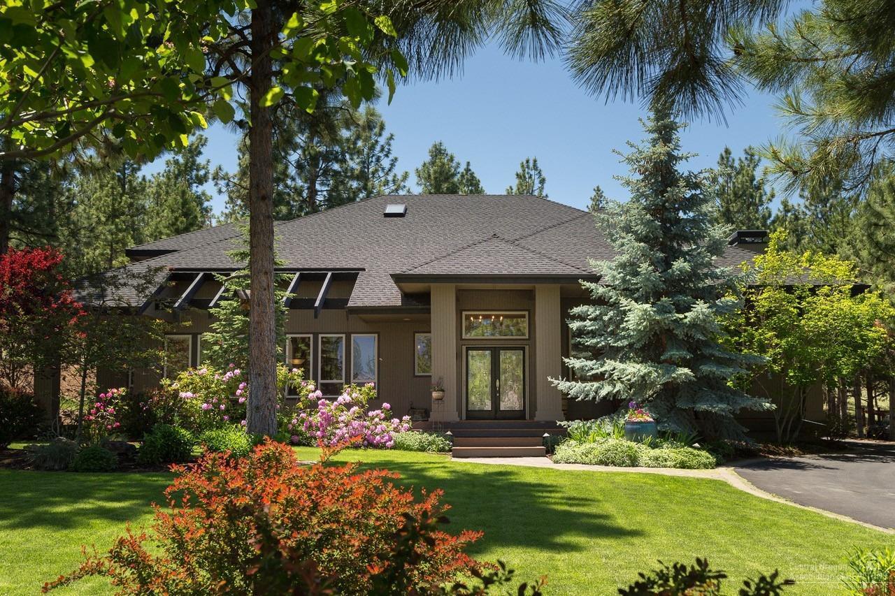 Stately grandeur w/sophisticated contemporary architecture are visible you approach this wonderful home. The grounds are meticulously maintained and alive with blooms. Backyard is a private paradise for tranquility & relaxation w/outdoor gas BBQ, fridge & fireplace. Don't miss the stunning impressive water feature & accent that make this exteriorscape so special. Interior opens from gorgeous entry foyer to spacious great room concept with arched openings, high ceilings & modern décor' fixtures. Open floor w/gas fireplace provides great separation and flow from master, kitchen & guestrooms. Impressive Island kitchen w/massive storage and breakfast bar. Well-appointed Master & Ensuite on main. Large bonus room could be media room use your imagination. This home offers all the best of Awbrey Butte and truly provides a very special living environment where entertaining is a dream. Beauty surrounds you from every angle of this wonderful home.  This is your new Remarkable home.
