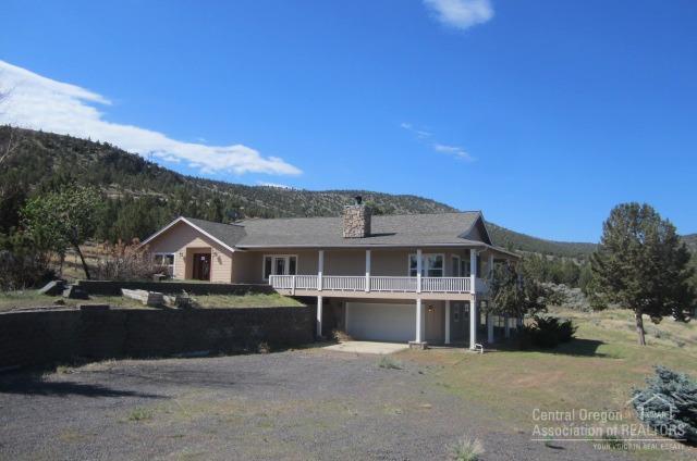 Amazing Cascade and Smith Rock views from this home near the top of Powell Butte! This home features upgraded flooring and countertops, oversized master suite, open floorplan with amazing views, wrap around deck, water feature, attached 2 car garage, tons of parking and acreage. Additional dwelling unit included totaling 447 sq ft. This one of a kind property won't last long!