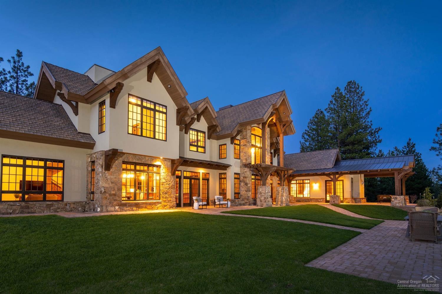 This architectural masterpiece is located in the Highlands at Broken Top, a premier gated community on Bend's Westside. Perfectly situated on private wooded 10ac parcel w/views to Bachelor & the forest. The massive stucco & stone exterior w/stately gabled roofline & structural timbers is a true statement of superior craftsmanship. Enter into the grand gathering rm w/a two story vaulted wood ceiling, picture windows & Montana Moss stone wood burning FP as a centerpiece. The interior is rich w/use of solid Cherry wood cabinetry & wall paneling, exposed beams & radiant heat Travertine floor. Floor plan offers another great rm area anchored by the perfect kitchen w/granite & Okite countertops, breakfast bar, eating nook & family room w/FP. The luxurious main level master suite has vaulted ceilings, sitting area & FP. 3 bdrm suites upstairs, bonus room w/wet bar, bthrm & flex room w/built ins. Paver patios provide space to entertain & BBQ. Pre-wired & plumbed for a future outdoor kitchen.