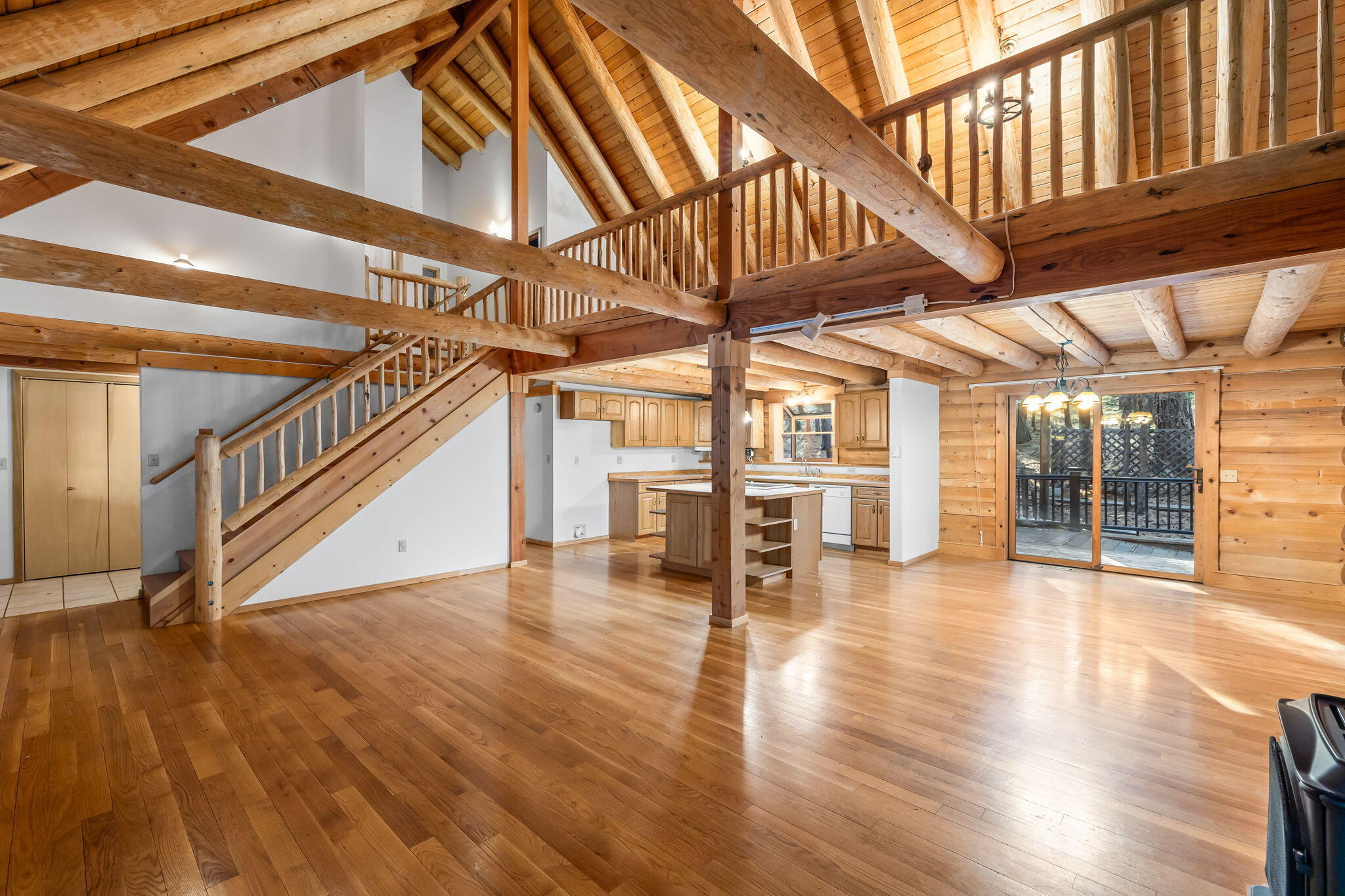 Find peace and quiet in this beautiful log home on nearly an acre nestled among the trees in Sisters Oregon. The Crossroads community is minutes away from Downtown Sisters as well as Black Butte Ranch and surrounded by Deschutes National Forest.  Your next adventure is right outside your front door. Both the main living space and the large lofted area enjoy the wonderful vaulted ceiling. The main level Primary bedroom looks out to the covered front porch with wonderful natural light. Upstairs is a large loft area as well as two generous bedrooms, both with high vaulted ceilings and full bath. The nearly 1,225sf shop/garage offers plenty of room for storage, toys or even a large RV with its 14ft center rolled door and 35ft x 14.3ft center bay with RV 120v 30amp outlet. The Crossroads community even allows horses. What else could you ask for? Come make this wonderful log house your home.