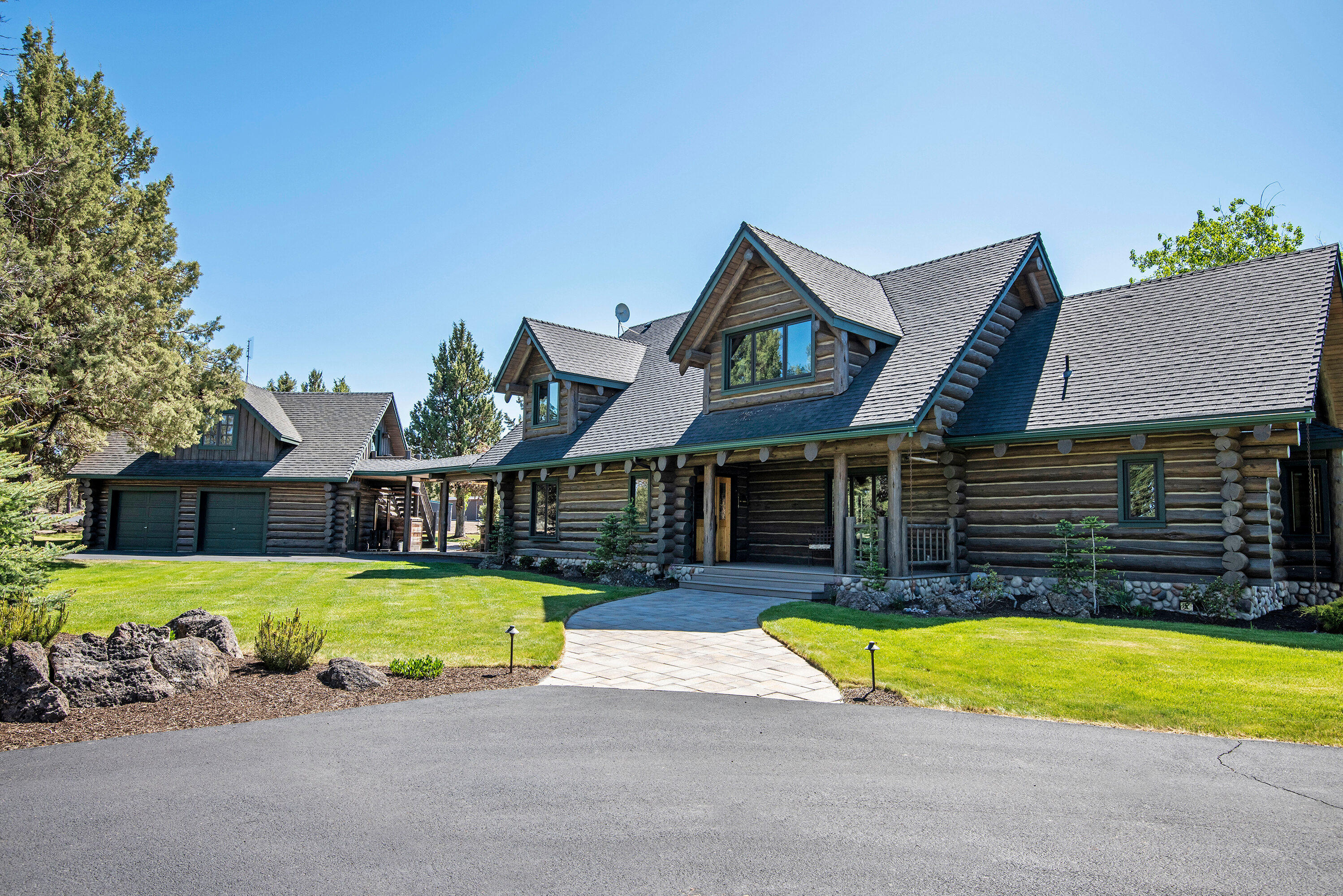 This unique 67-acre property is a must see with incredible privacy; wildlife by the pond w/ outstanding Cascade mtn. views. The property abounds with great living space including a detached 3-car garage, 2-bay shop, horse enclosure w/loafing shed, & more. Enjoy modern amenities in a fully renovated charming log home. Main level is open floor plan for full views, with a guest room w/full bath & private entrance to patio. Chef's kitchen has a Wolf gas burner, electric convection oven, abundant storage, butler's pantry, wet bar & temp-controlled 330-bottle wine closet. The primary suite up features a huge walk-in closet w/ washer/dryer. Its bath has a soaking tub, dual head shower & double vanity. The 3rd bedroom is currently an open loft office. Guest quarters above the attached 2-car garage have 2 sweet built-in king-sized beds, living area & full bath. The outdoor kitchen, built-in propane fire pit, hot tub & sauna await. You must see this one!
