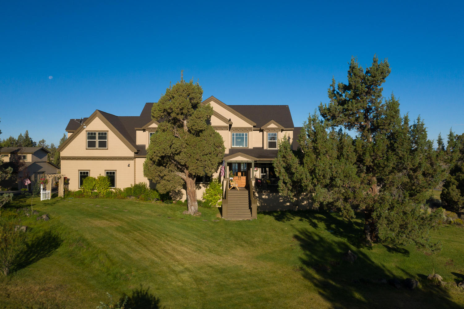 Peace, tranquility and lots of elbowroom & still just minutes from downtown Bend, Oregon! This amazing family home sits on 25 private acres with breathtaking Cascade Mt and seasonal canal views. There is also a view of the historic C-4 Ranch barn! The land surrounding this custom home is beautifully landscaped and must be seen to be appreciated. Upscale finish work throughout the home and a dream kitchen with stainless appliances and double ovens. Massive island made from ancient Sequoia Redwood tree caps-off the amazing kitchen.  Great room concept with floor-to-ceiling stone fireplace & efficient pellet stove with mantle made from 1,000-plus year old Juniper tree. 480 sq ft living area above spacious shop building is great for generational living. Room to park 4 cars as well! EFU zoning affords a multitude of land uses.  Come and see this beautiful Central Oregon hideaway.