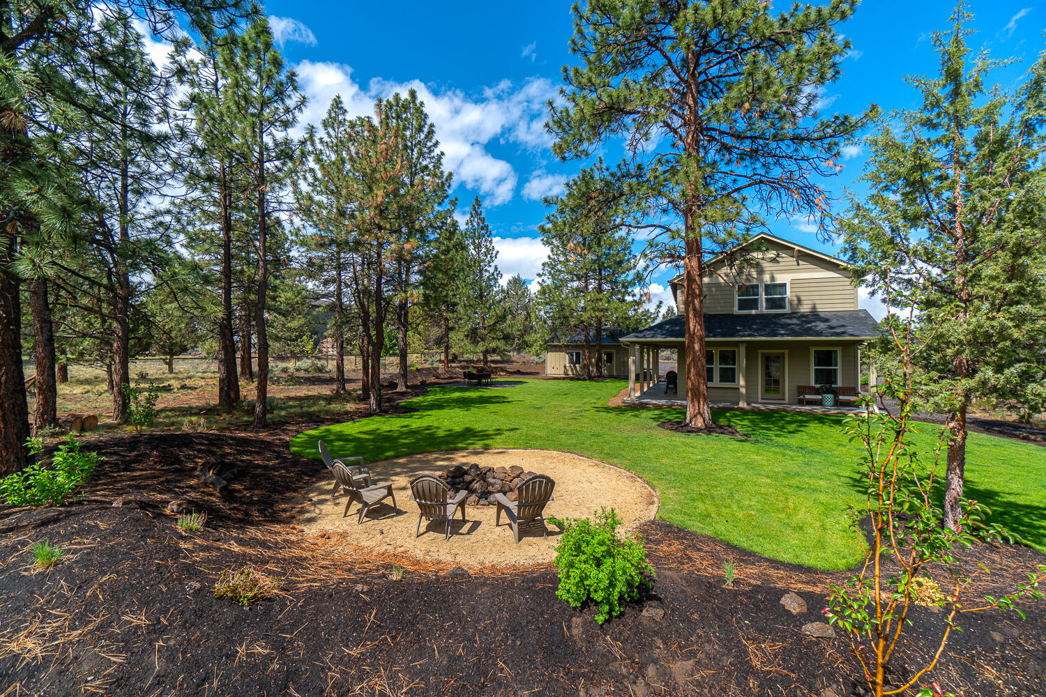Peace and tranquility await in the quiet Sundance neighborhood in SE Bend. This fully fenced and gated 3.25 acre property is set up for a horse property or small farm and sits just minutes from town. The tastefully renovated home was updated nearly floor to ceiling in 2016. More recent updates include a detached two car garage, fully landscaped backyard, large paver patio and fire pit. The stamped concrete covered porch welcomes you to the heart of the home with an open living area and kitchen. Beautiful countertops, stainless steel appliances and wide plank tile floors all sit under the large exposed beams. Custom reclaimed barn wood pieces adorn the home on the fireplace mantel, bathroom vanities and barn wood door. You must see this home to appreciate the thoughtful renovations and custom features throughout. Please see the attached features list for all the renovation details. This home is shown by appointment only, call to schedule your tour today.