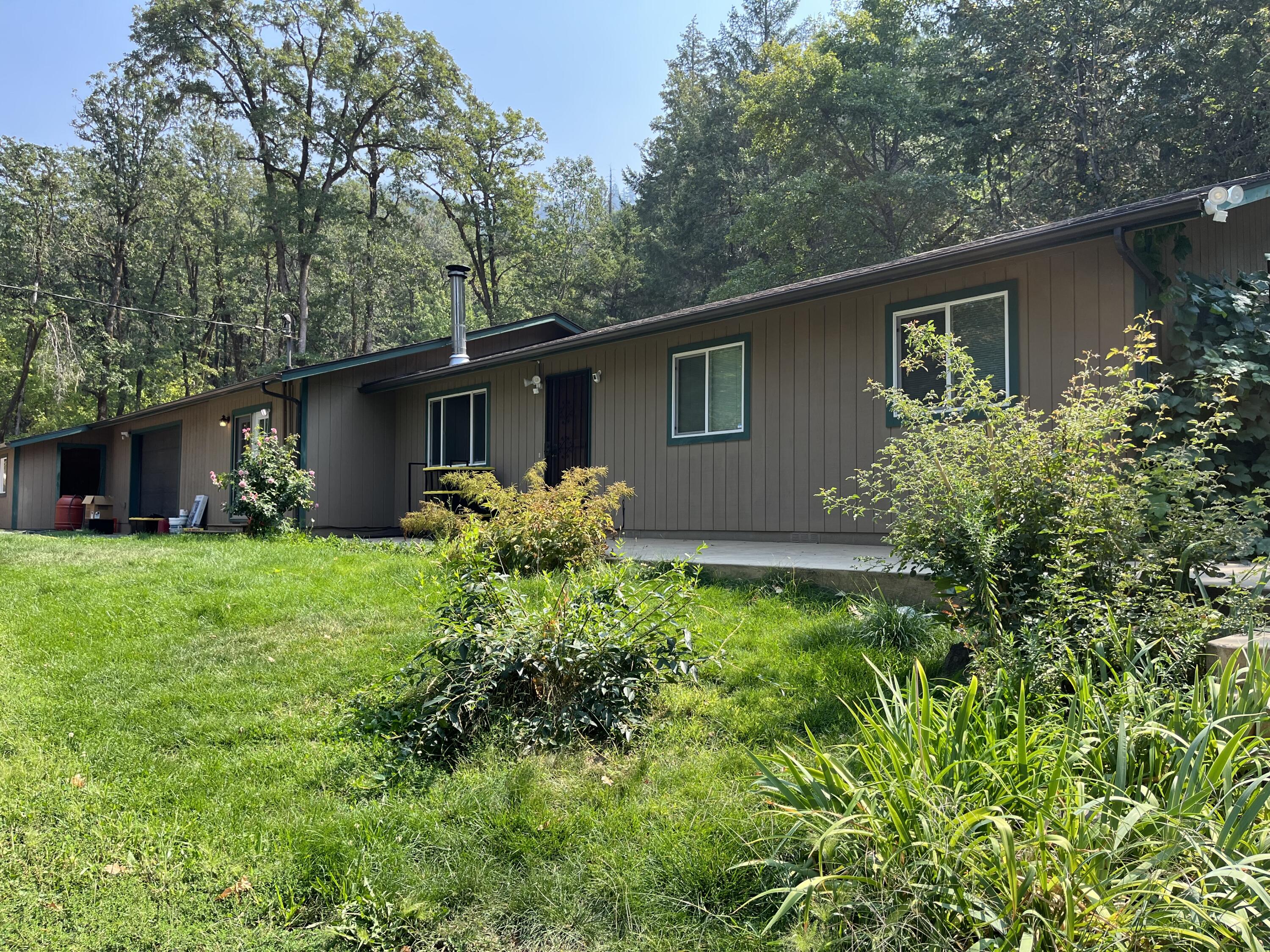 This home is full of upgrades and updates, come see this wonderful home on 5 acres with a pond. The property is private and secluded, greenhouses, 2 sheds, insulated 2
car garage approximately 600 sq, 200 amp service and well house with ultraviolet light. A laundry room connects off an extra room that can be used as an office, also an
attached wood shed and storage area. There is plenty of parking on gravel driveway, new roof in 2022, new gutters, new pergo floors & new carpeting in the bedrooms. Bathrooms updated with a new vanity & shower in one bathroom and new toilets in both, kitchen counter and appliances updated all freshly painted interior. The seller indicates the well is a good producer and one of the best water in the area. The septic has recently been pumped. A wood burning stove is in the living room with stone & decorative block. Come see this amazing property & make an offer. OWNER CARRY with $100,000 downpayment, a 5 yr term, & upon seller's approval of final terms.