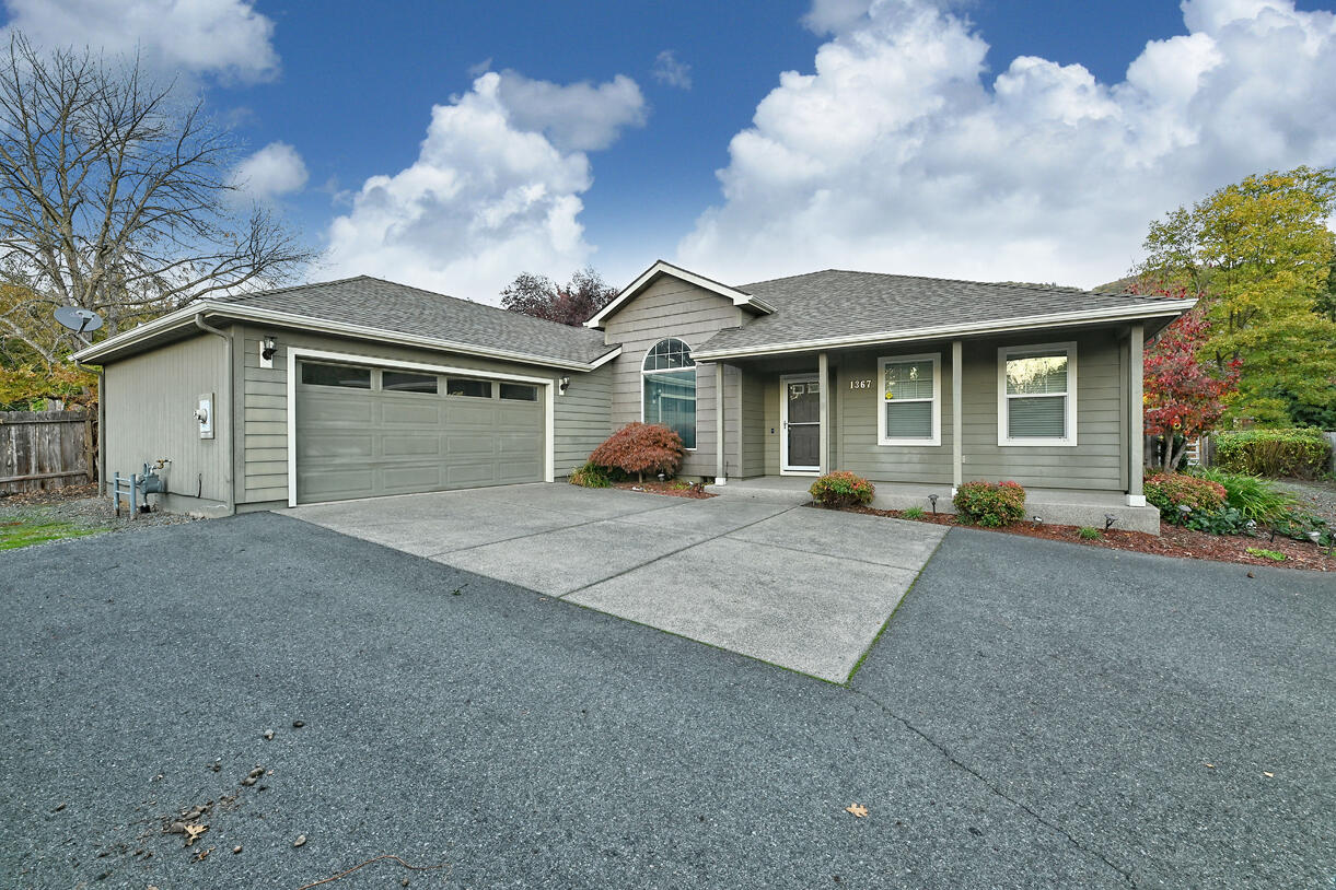Welcome to a remarkable home in a charming Northeast Grants Pass neighborhood. This well-loved residence seamlessly blends the comfort of a home w/ modern amenities. Inside, you'll be embraced by granite countertops, elegant hardwood floors, & the warmth of a gas fireplace. The open floor plan seamlessly connects the great room to a formal dining area, creating a versatile space for gatherings & entertaining guests. The kitchen is a spacious & welcoming hub, featuring granite countertops, custom cabinetry, & a charming breakfast nook that beckons you to savor your morning coffee. The master suite is spacious w/ a walk-in closet & a master bath offering a tiled shower, a soothing soaking tub, & double sinks.  Outside, the property offers ample parking space w/ an oversized double-car garage & trailer parking, ensuring room for all your vehicles & outdoor equipment. This residence is more than a house; it's a canvas for your dreams and a place where cherished memories are made!
