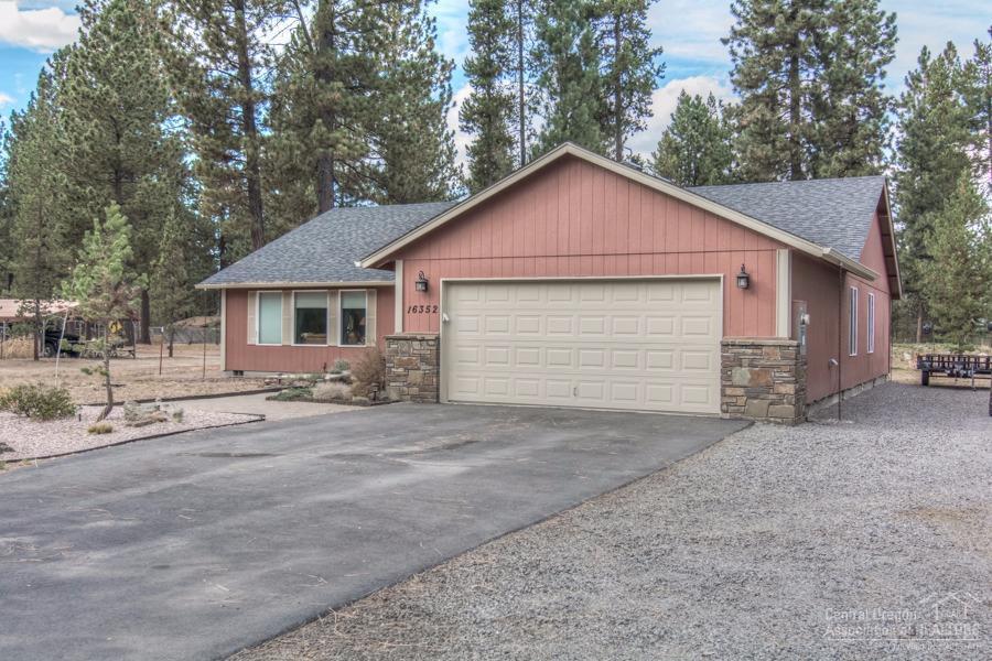 Updated kitchen, baths, and flooring, this home is better than new! Even the garage has had a makeover! Hardwood floors, vessel sinks, tiled counters make this home feel like a magazine! Single level living in a well designed floor plan with special touches in every room. Large cleared lot with paver patio and a fire pit. Quiet setting and ready for new owners.
