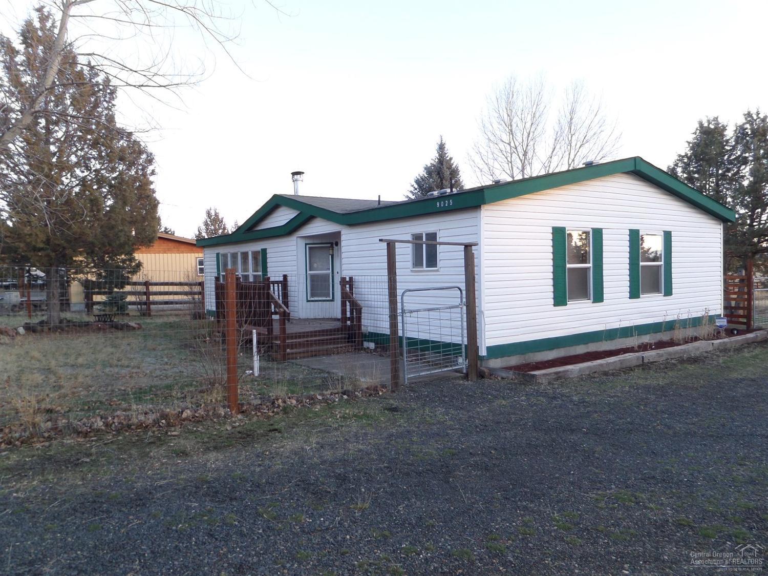 Nice starter or vacation home. 2 bed 2 baths backs up to the community park and 90 acre pasture with walking trail. Lots of updates, some new flooring, new dishwasher, new back door and new window screens. Interior is painted in warm colors. Wood stove to warm you in the winter, window air conditioner to keep you cool in the summer.
