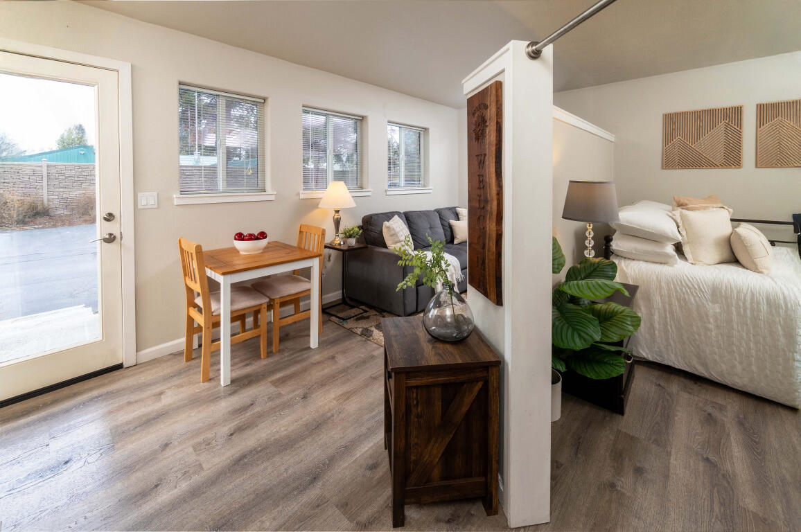 Charming turnkey studio with a thoughtfully furnished and nicely decorated natural light filled interior. A partial partition creates a private sleeping area, while a sunny patio offers the perfect spot to relax or BBQ. Enjoy on-site resort style amenities including a seasonal pool, year-round spa, laundry facility, snow removal, grounds maintenance, and convenient parking. HOA dues also cover water, sewer, and garbage. The unit includes a lockable storage space in the covered entry. Ideally located minutes from Sunriver Village, the Deschutes River, golf, dining, shopping, and miles of walking and biking trails. Just 20 minutes to Mt. Bachelor and steps from local conveniences such as the post office, library, school, gas station, food trucks and brewery. Short-term rentals allowed, making this an excellent getaway or investment opportunity. Welcome to your basecamp for Central Oregon adventure!