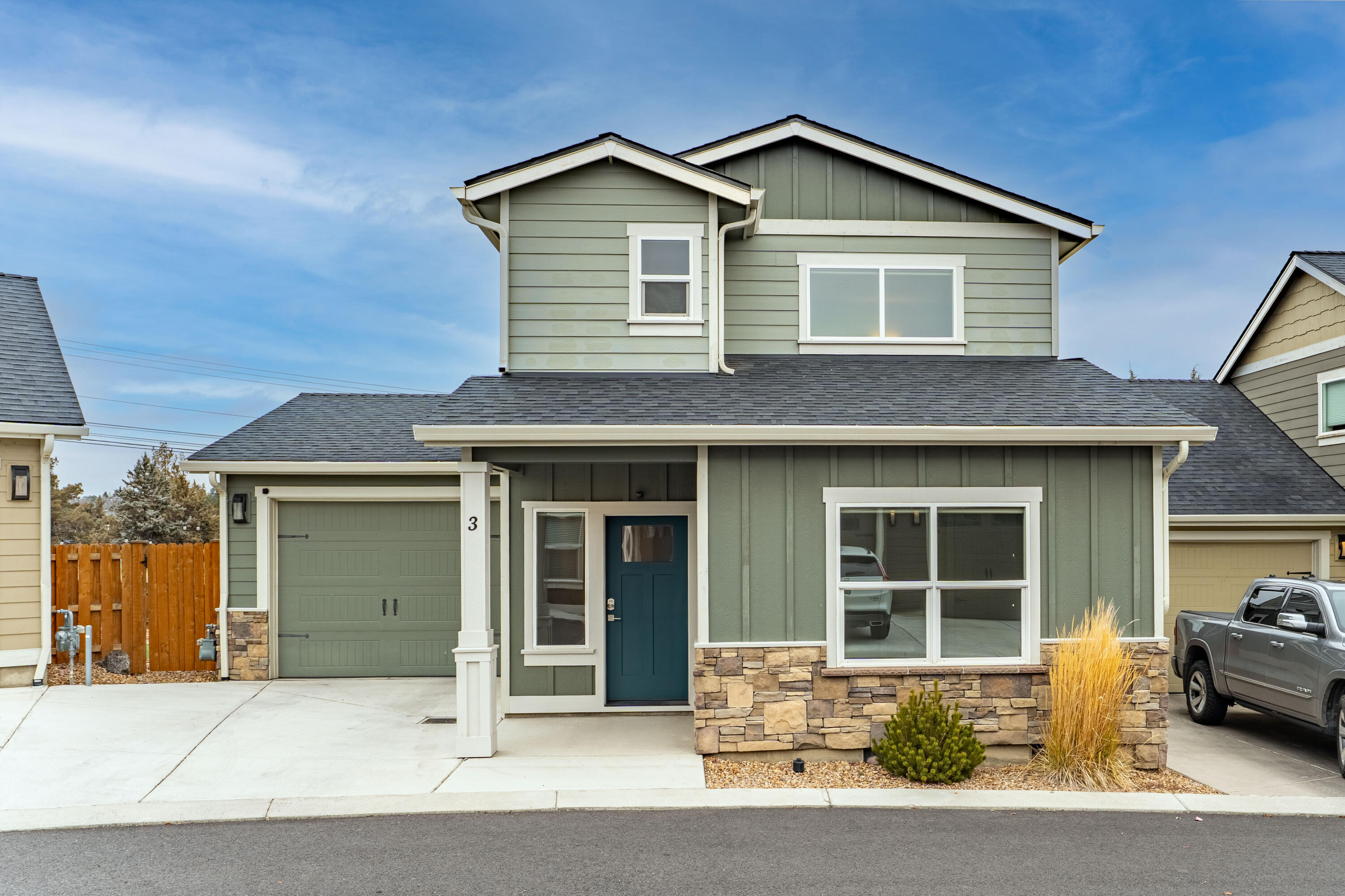 Welcome to The Links at The Greens! Low maintenance, easy living at its finest. This stand alone condo is well suited as a primary home, or your home away from home, situated in The Greens golf community in SW Redmond. The home offers a main level primary bedroom - complete with a walk in closet, tiled shower and solid surface tops. Also on the main level you'll find a powder room, laundry closet, dining area, living, and a spacious kitchen boasting functionality and style with quartz tops, full height backsplash, under-cabinet lighting, and stainless appliances. Upstairs has a  loft, second bedroom and full bathroom. Extended single car garage has enough room for a car and golf cart! The back patio and large side yard offer low maintenance landscape so you can spend your down time enjoying soothing sounds of the canal when in season. The community offers water, sewer, and garbage services in the dues, snow removal, common areas, landscaping, and walking trails. Welcome home!