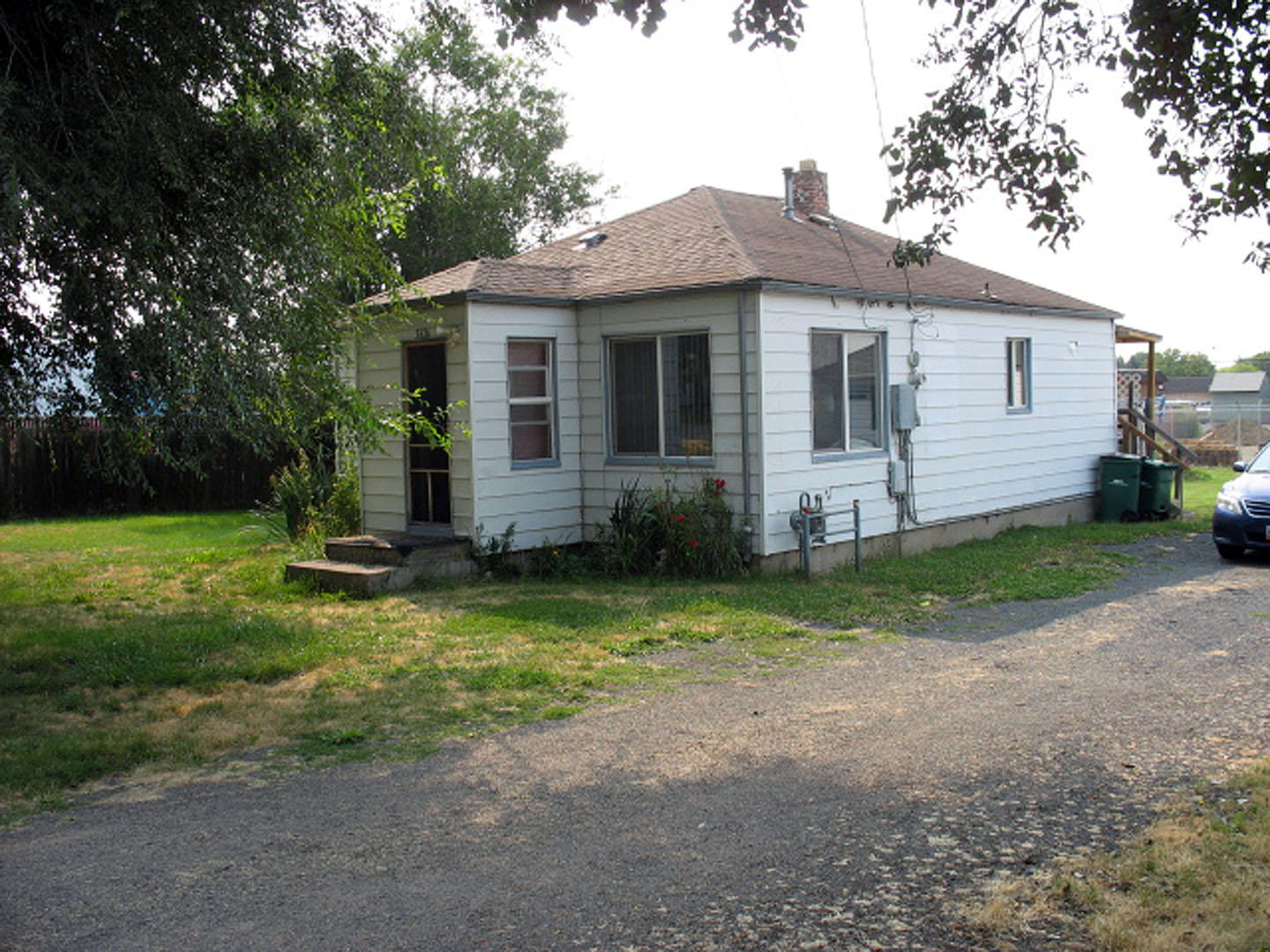 Super cute 2 bed/1abth, 779 sq ft home on approx .26 acre. Hardwood flooring, vinyl in the kitchen area. Nicely treed front yard, property also has a couple of fruit trees. Gas heater was replaced in 2019. There are commercial properties on either side of this home. Irrigation is supplied by Enterprise Irrigation District.