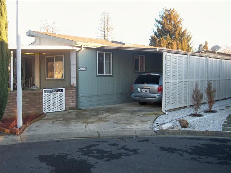 Delightful Willow Estates So. Manufactured Home! This 1988 Manuf. Home, in 55+ Park, is terrific and features 2 bedrooms, 2 bathrooms, 1248 sq. ft. private setting with all kinds of EXTRAS! Some extras include vaulted ceilings, large kitchen with tons of cabinets, and all top-of-the-line appliances, skylight w/screen that opens for air, formal dining room, nice sized living room, roomy master bedroom with bath and outside patio for relaxing. Fully-fenced dog run with grass in back yard. Great location, nice neighbors, and close to everything! Very private. Priced to sell quickly at $30,000! Call to set up a tour to see it all. It won't last long!