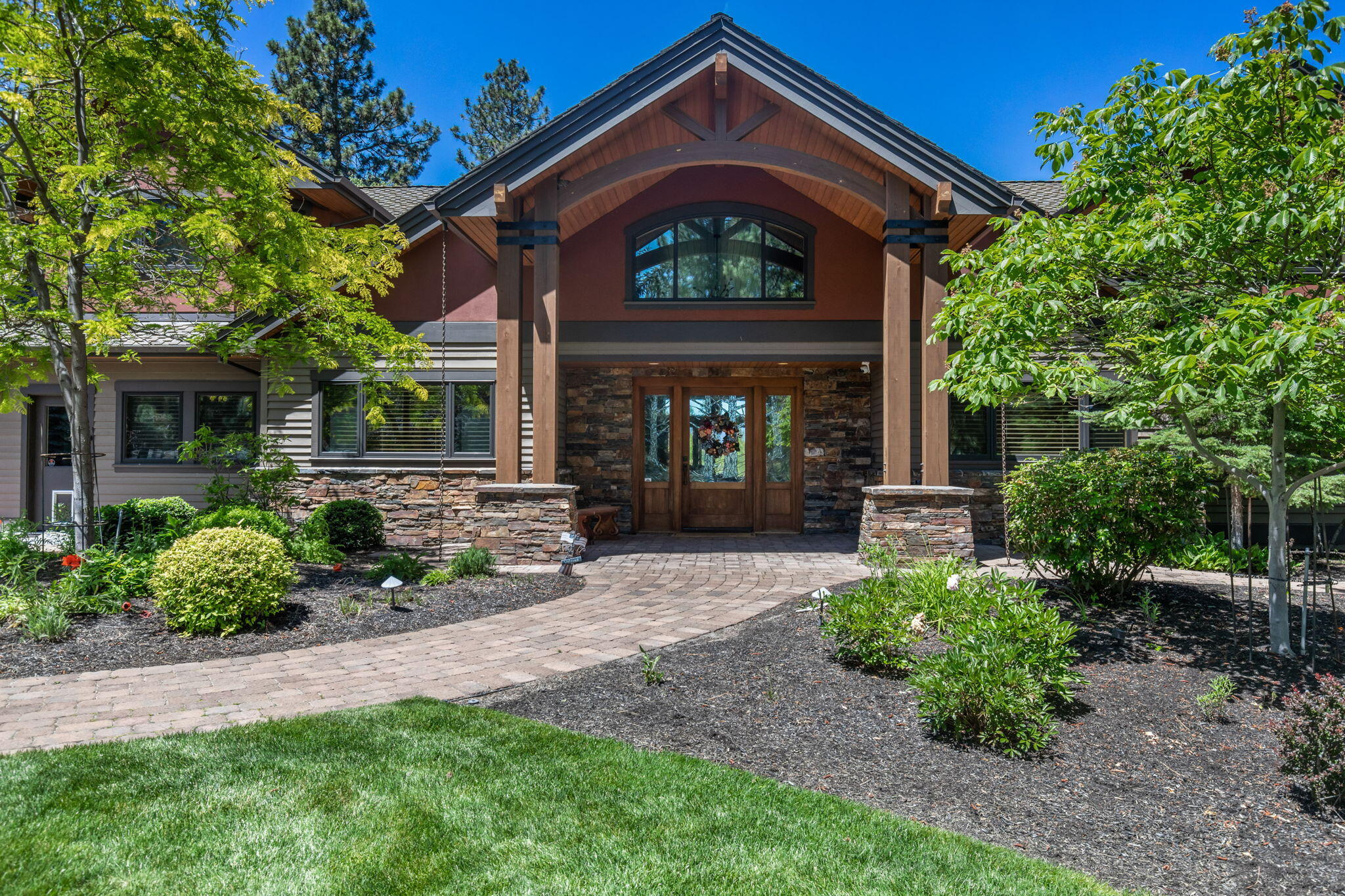 Luxurious Sun Forest Home. Feel the elegance when walking in the entry.  Main level living w/ Vast Custom Madrone woodwork. Exquisite kitchen w/ stunning Afromosia Cabinetry/Granite Slab/6 burner range/double ovens/warmer/wine fridge/2 kitchen sinks/dishwashers. Limestone floors/wool carpet/upgraded Sound System/2 stone fireplaces/remote blinds. Master Suite on main w/coffered ceiling/stunning master bath/heated floors/custom walk-in closet. 2 office spaces, laundry & 3 additional flex rooms.  2 additional bedrooms/bonus space 2nd level. Abundant storage. 2nd Suite with exterior exit. Potential ADU. 2.23 ac. property with privacy. Meticulously landscaped: cascading water fall ending at a tranquil pond.  Manicured landscape multi. fruit trees/gardens. Stone patio creates private and entertaining sitting areas. Grand firepit under covered patio, views of Cascade Mtns/outdoor kitchen.  BBQ/sink/minifridge/auto. outdoor blind.