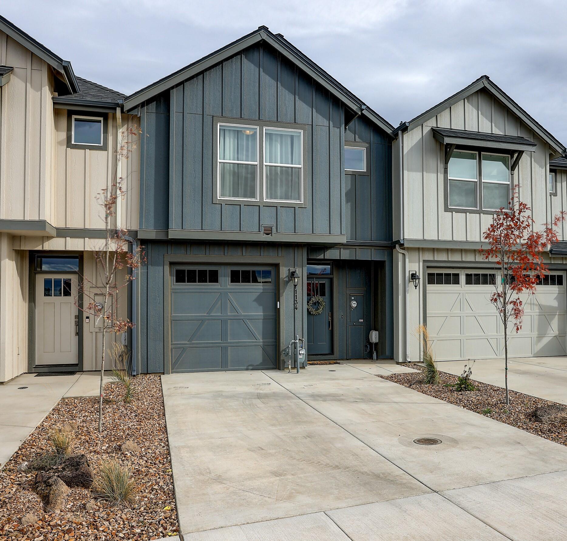 Beautiful and modern farmhouse feel and touches in a sought after neighborhood in NW Redmond. Open floorplan downstairs with 9' ceilings make you feel right at home. Upstairs there are two walk in closets for the primary bedroom along with sweeping mountain views. Laundry and extra open space that could be used as an office are also upstairs.
Fully fenced and landscaping taken care of for you in the front as well as exterior home maintenance with the HOA makes for easy living.
Spacious single car garage with 252 sq ft and extra storage throughout don't miss out on this opportunity!