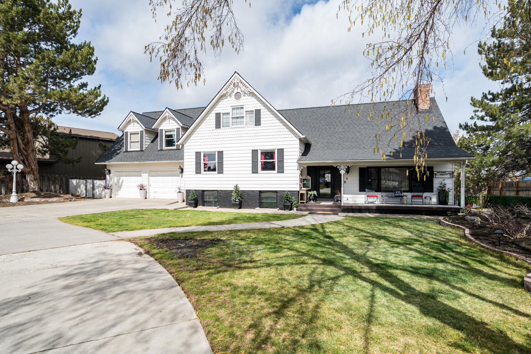 This stunning country Victorian-style home is truly one of a kind in a stellar location right on Dry Canyon in the heart of Redmond. Walk-in & you'll notice the gorgeous woodwork throughout. Living room offers a stunning full brick wall with a gas FP. The kitchen has been extensively remodeled with Café™ appliances, butcherblock counters, spacious walk-in pantry, & French doors out to the dining sunroom. Your backyard transitions into canyon trails & parks & gives you the option for RV or toy parking. Bougie chicken coop included. Basement includes media room, hidden closet, screen, bedroom, half bath, & laundry room. Mid level includes 2 large bedrooms, one with ensuite, & full bath in hall. Primary suite is beyond spacious with vaulted ceilings, amazing mt views, & 2 story walk-in closet with org system. Large newly renovated primary bathroom includes a full steam shower & soaking tub. Lastly, a good sized office. Minutes away from breweries, shops, schools, & so much more! New roof!